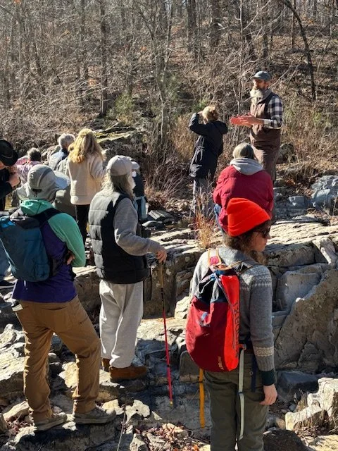 Eric & Joanna lead a geologically curious group at a site visit