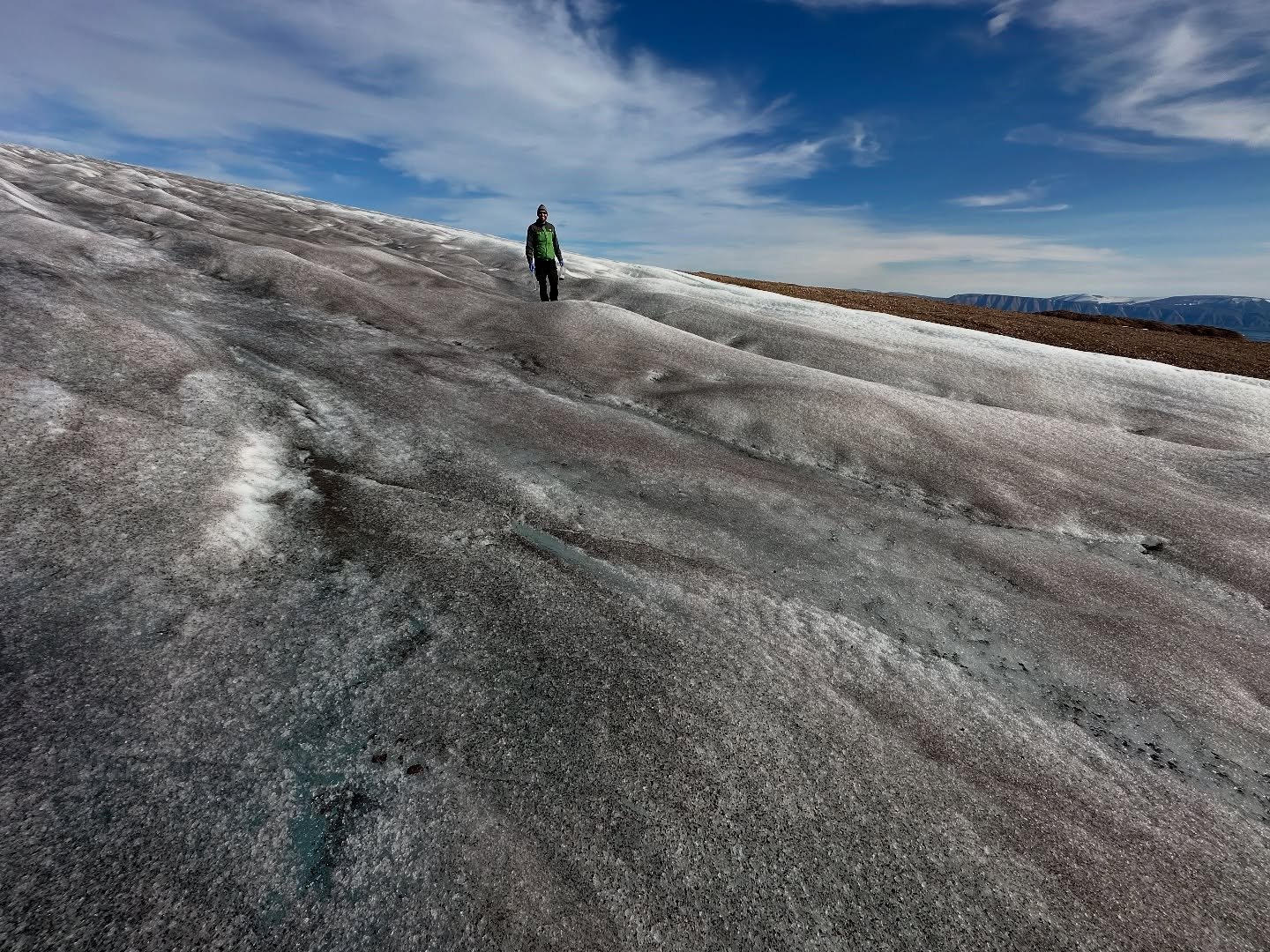 &bull;&bull; What is the dark ice of Greenland? Greenland&rsquo;s ice sheet can appear dark due to dust from the atmosphere, and microorganisms like ice algae. That darkness absorbs more sunlight and causes the ice to melt faster. The algal bloom spr