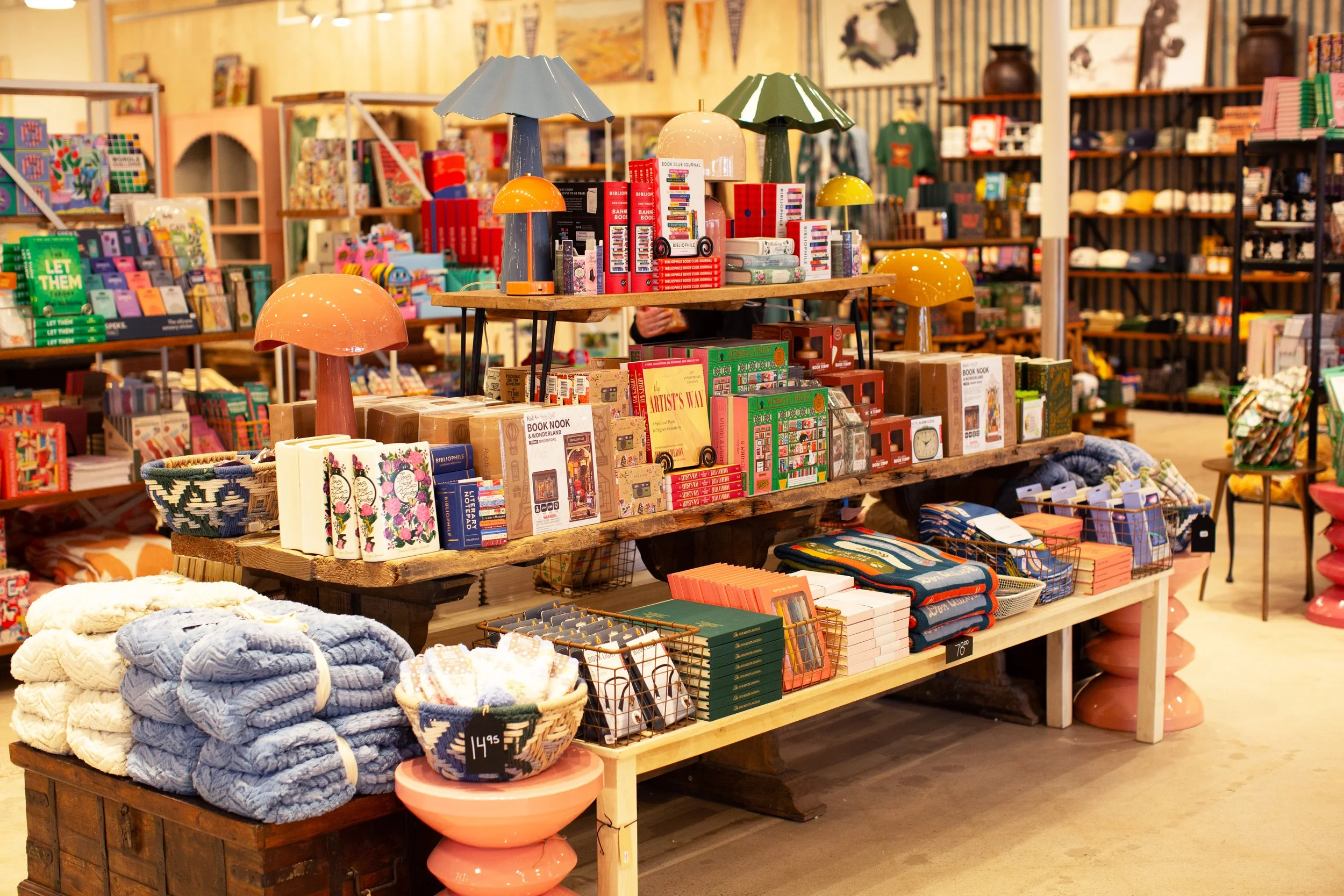 Books, blankets, puzzles, and more on the shelf at a Patina store