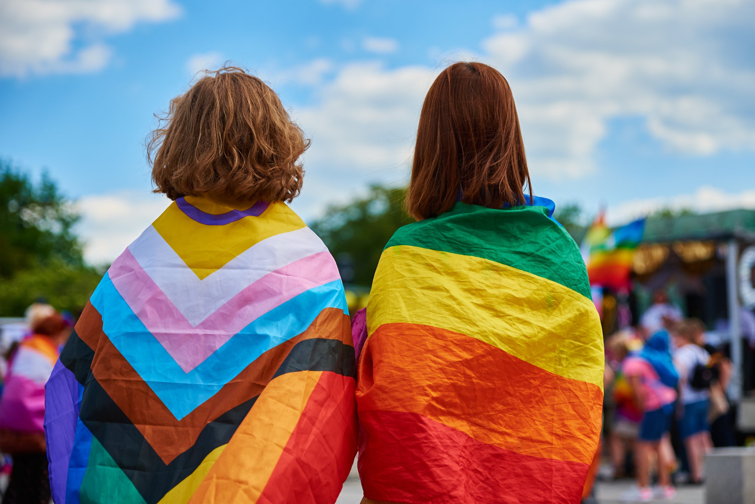 two-women-with-lgbtq-rainbow-flags-on-pride-demons-2022-12-16-12-44-50-utc.jpg