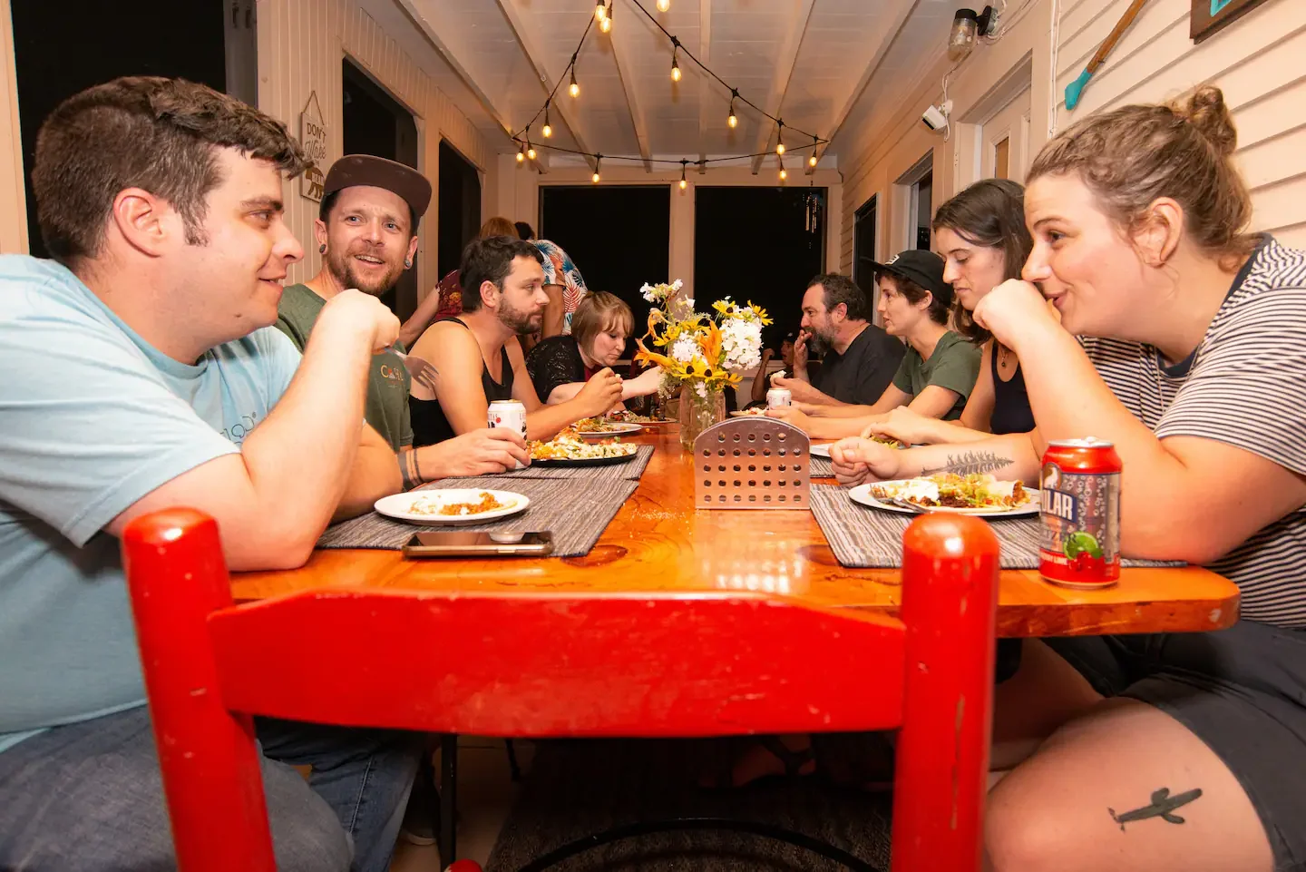 CoHo Hostel, Back Porch, meeting people over a meal.webp