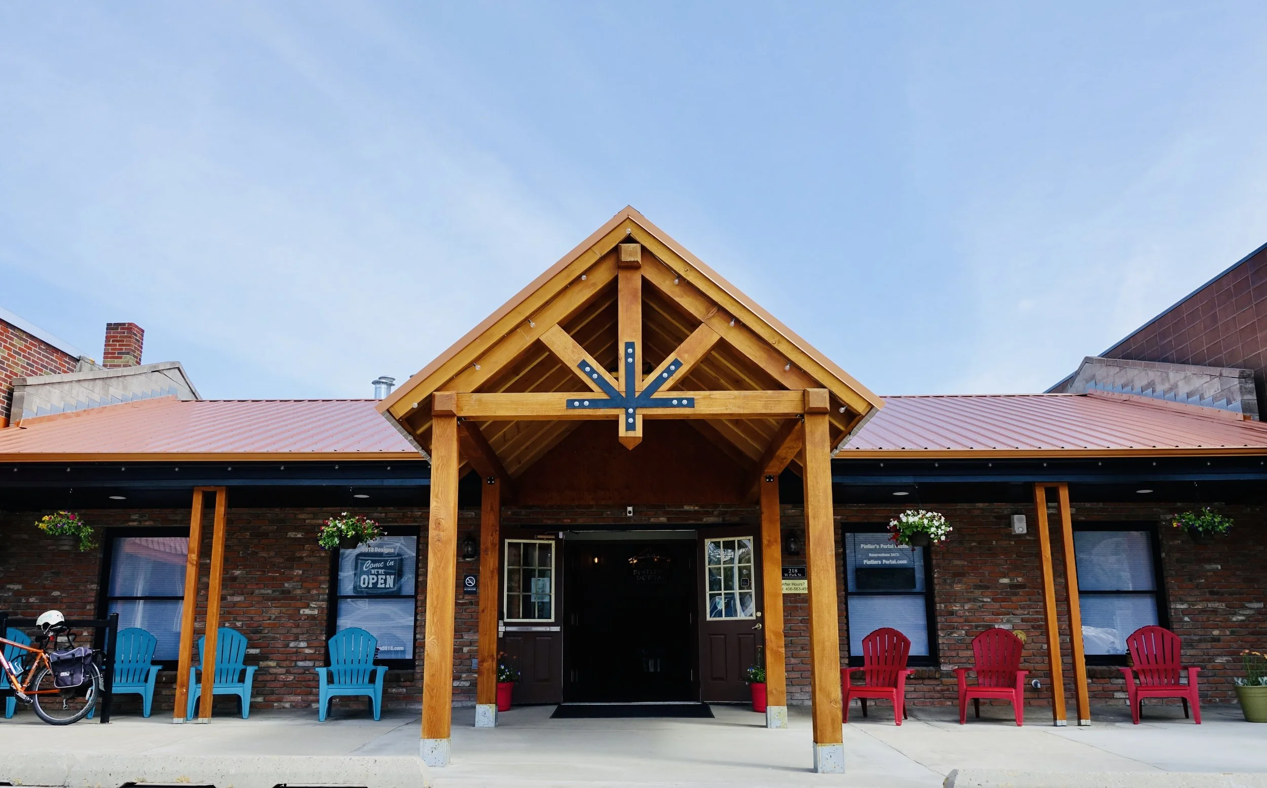 exterior front entrance with wood work and bricks in Montana