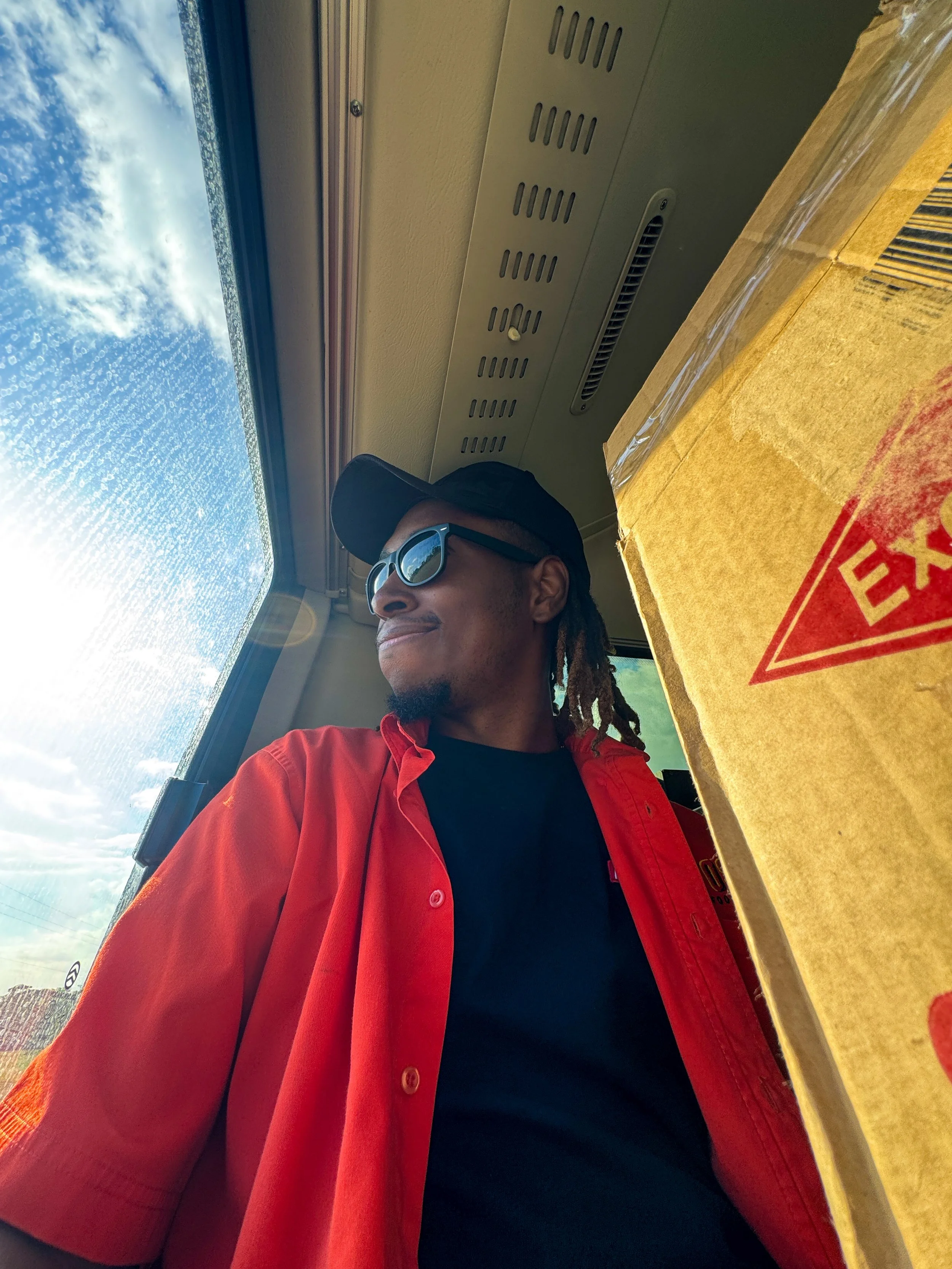 man wearing an orange shirt