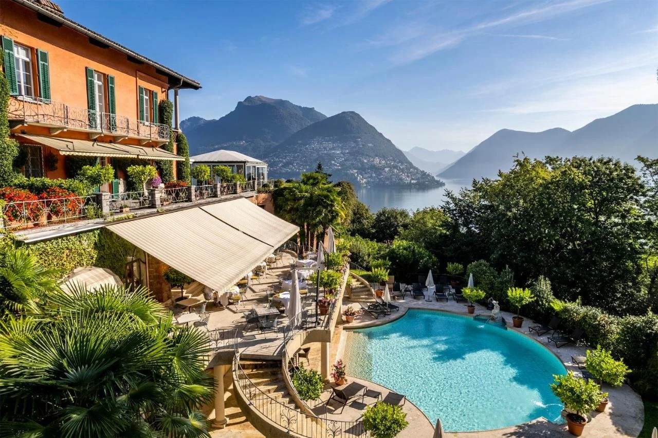 Villa Principe Leopoldo Lugano terraced garden with outdoor pool and panorama of Lake Lugano and Monte San Salvatore