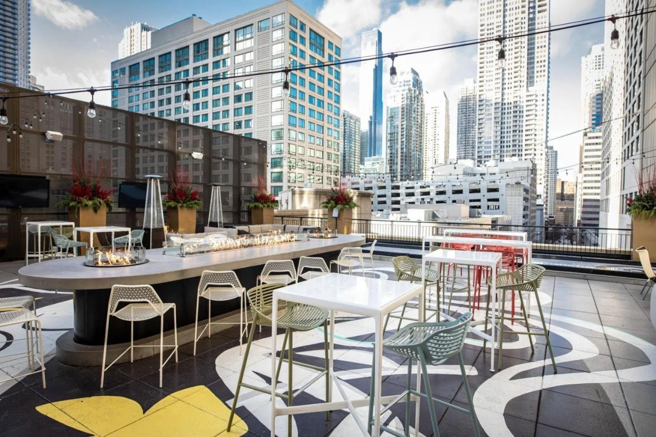 The Gwen Luxury Collection Hotel Chicago Art Deco limestone facade with rooftop terrace and skyline views