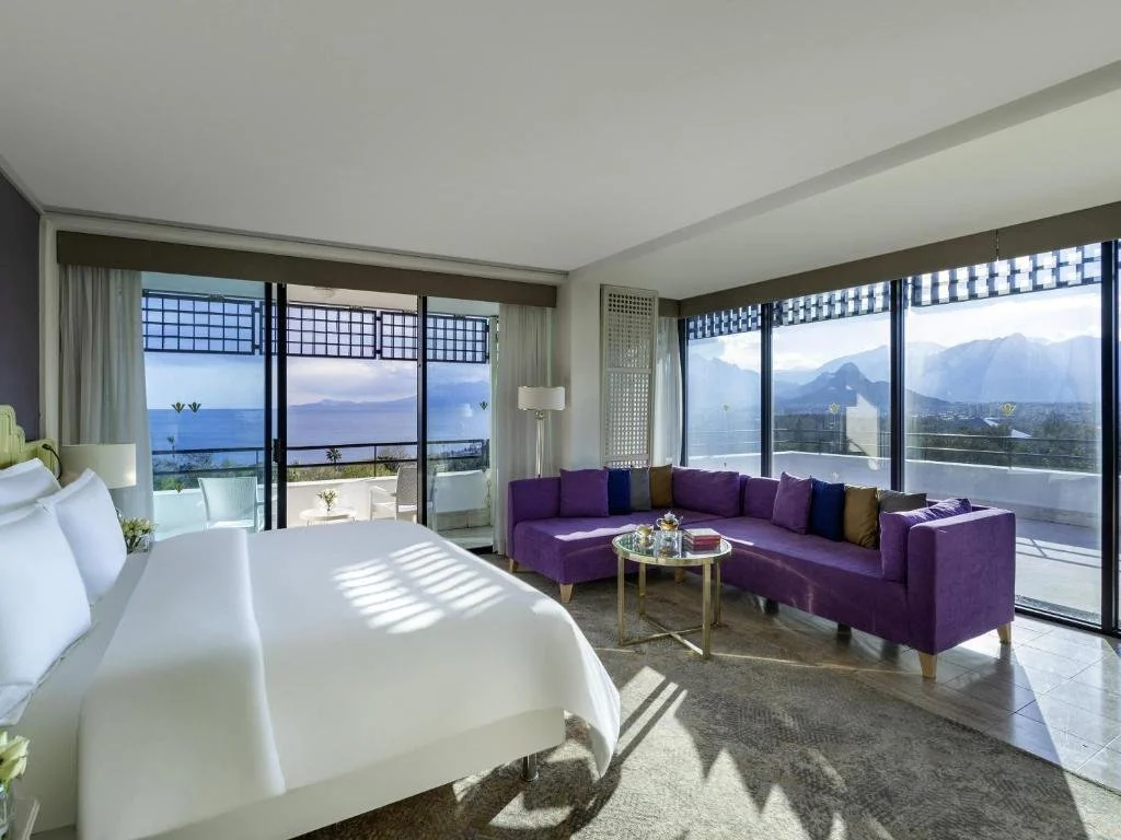 Rixos Downtown Antalya suite with floor-to-ceiling windows framing simultaneous sea and Taurus Mountain views