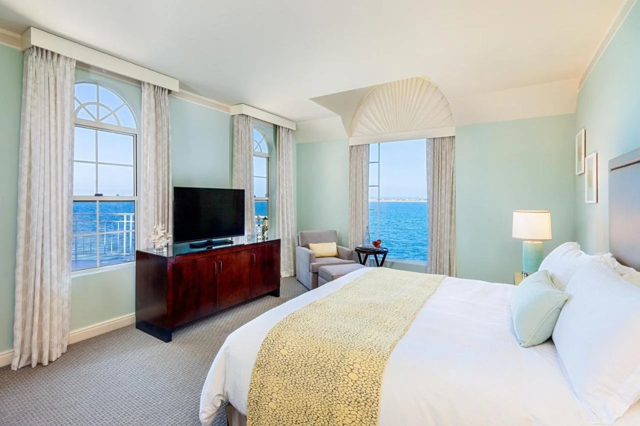 Loews Coronado Bay Resort Coronado suite with arched windows and direct San Diego Bay view