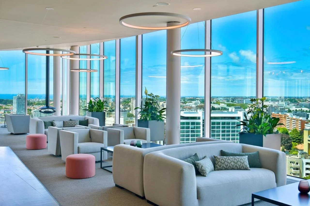 Porto Palácio Hotel by The Editory rooftop lounge with floor-to-ceiling glass and panoramic view over Porto city to the Atlantic