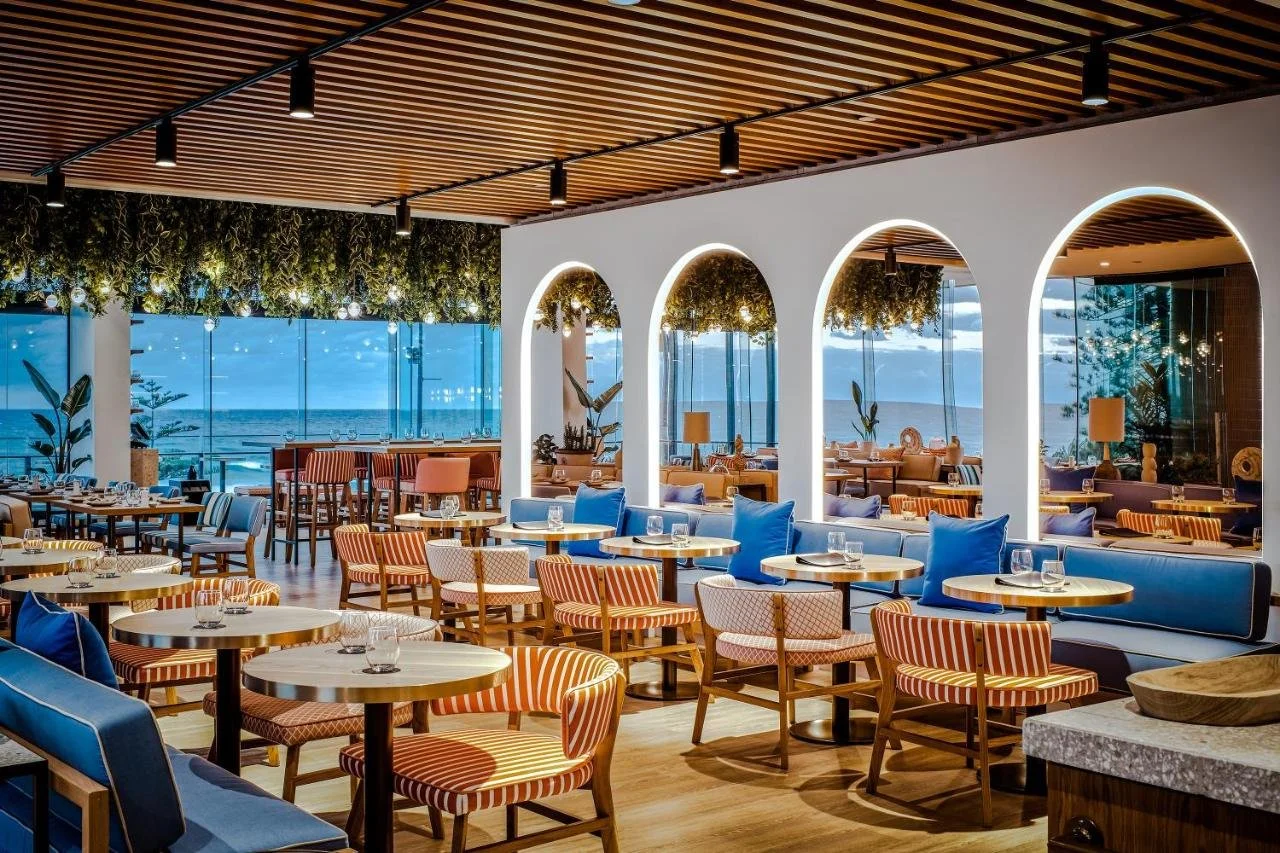 Peppers Soul Surfers Paradise Hyde Paradiso oceanfront restaurant with arched windows facing the Pacific Ocean at dusk