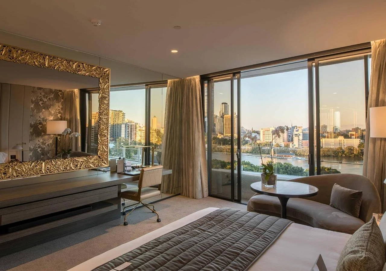 Emporium Hotel South Bank Brisbane room at golden hour with Brisbane River and CBD skyline view