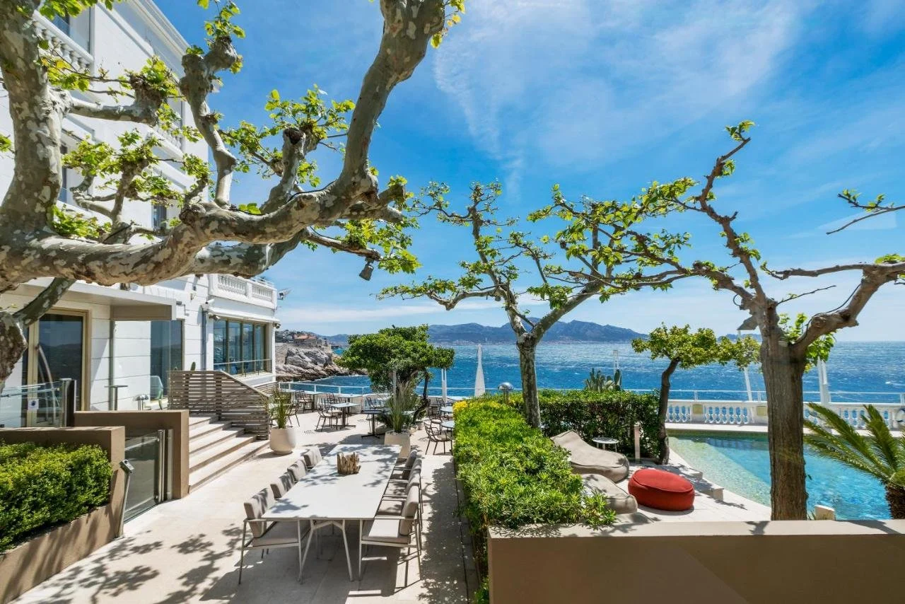 Le Petit Nice Passedat Marseille seafront terrace with outdoor pool and rocky Mediterranean coastline