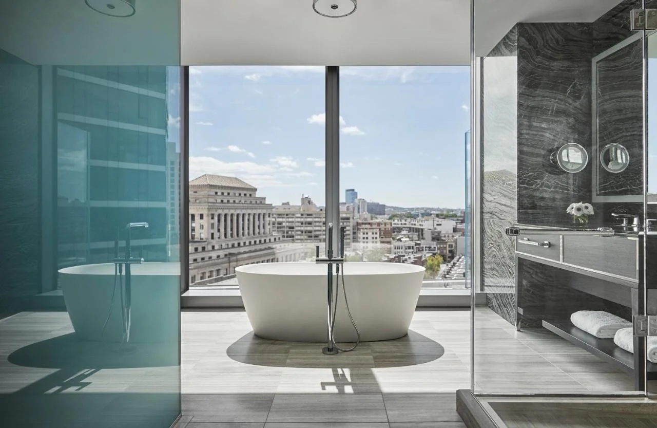 Four Seasons One Dalton Street Boston luxurious suite with panoramic bathtub facing The Mary Baker Eddy Library