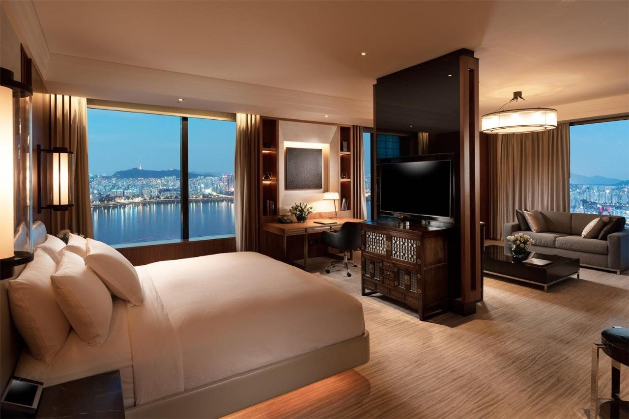Spectacular hotel corner suite with Seoul skyline views at night, South Korea