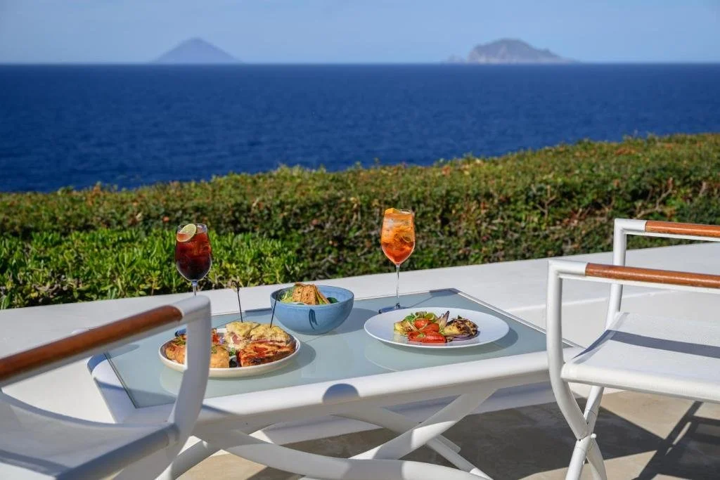 Capofaro Resort Salina terrace lunch with Stromboli and Panarea islands in the background