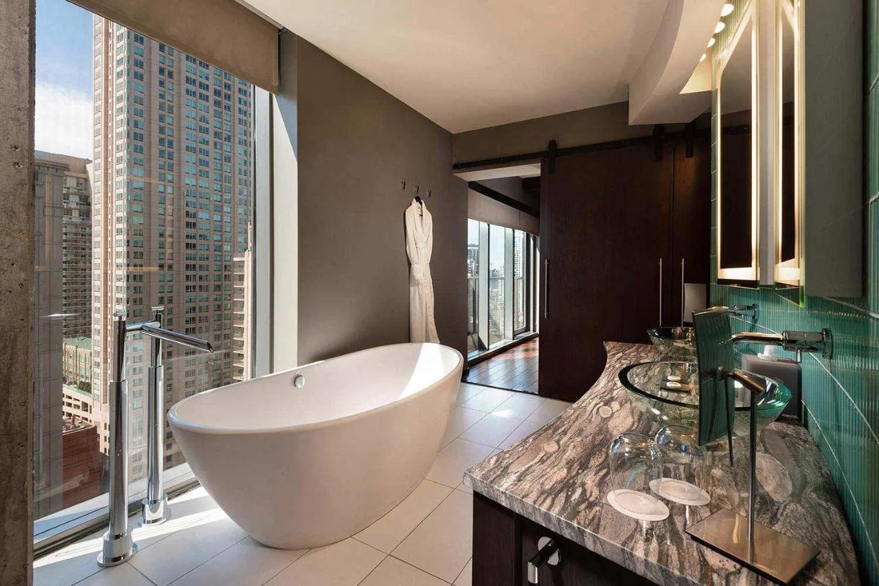 Eurostars Magnificent Mile hotel bathroom with Chicago skyline views