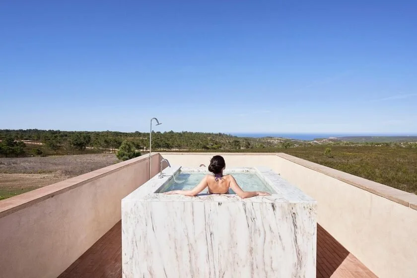 Praia do Canal Nature Retreat Aljezur rooftop marble plunge pool overlooking Vicentina Coast nature reserve and distant Atlantic Ocean