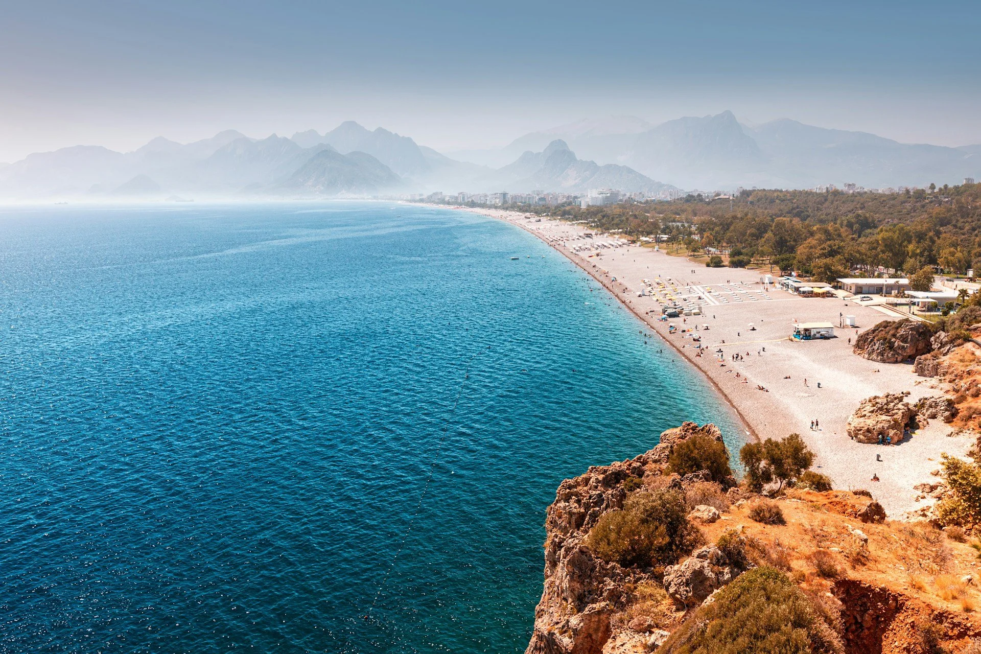 Antalya Turkey aerial view of Konyaaltı Beach with turquoise Mediterranean water and Taurus Mountains