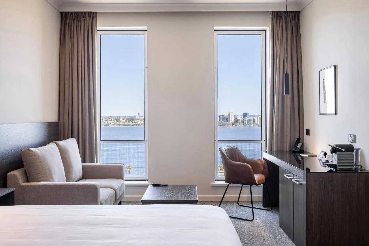 Duxton Hotel Perth room with dual windows framing Swan River and South Perth skyline