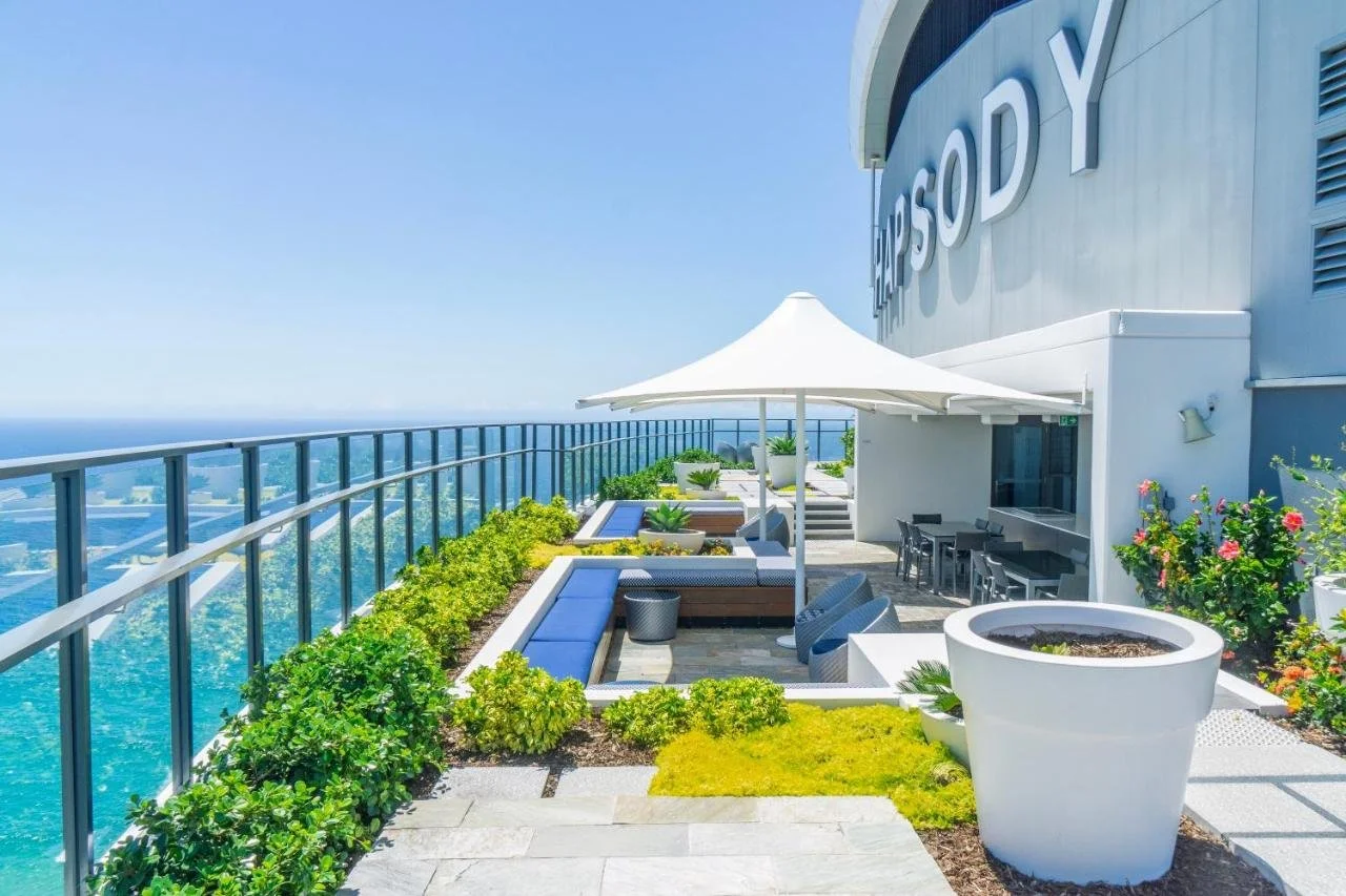 Rhapsody Resort Surfers Paradise rooftop terrace with landscaped garden, pool, and open ocean view