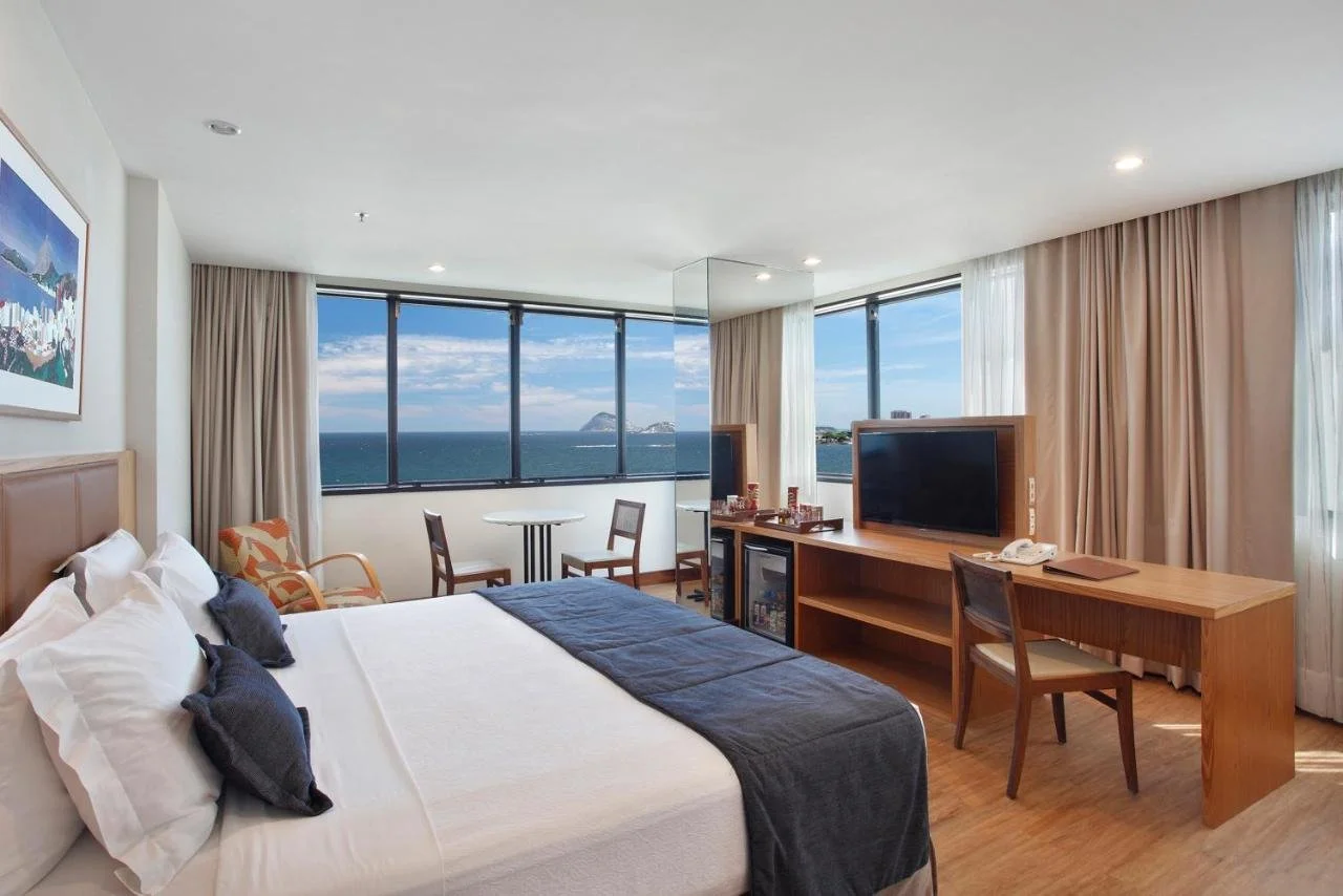 Windsor Excelsior Copacabana Rio de Janeiro ocean-view guest room with corner windows facing the Atlantic and Cagarras Islands