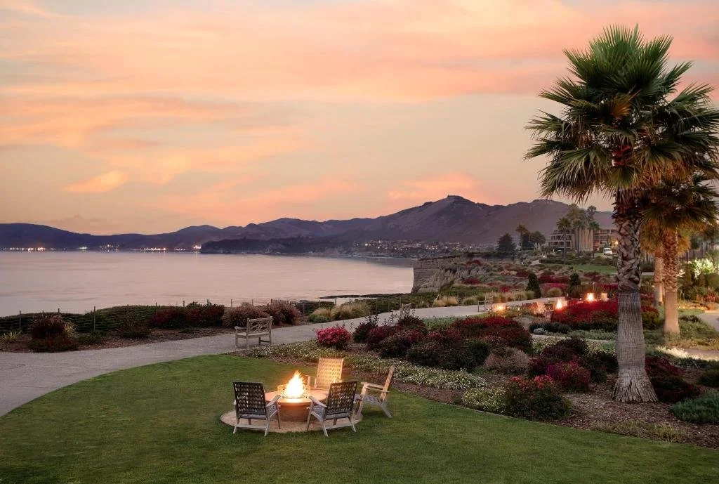 Spyglass Inn Pismo Beach fire pit on a garden facing the Pacific at sunset