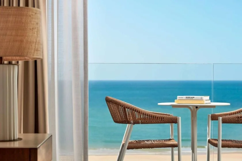 Tivoli Marina Vilamoura hotel room balcony with wicker chairs and unobstructed Atlantic Ocean view