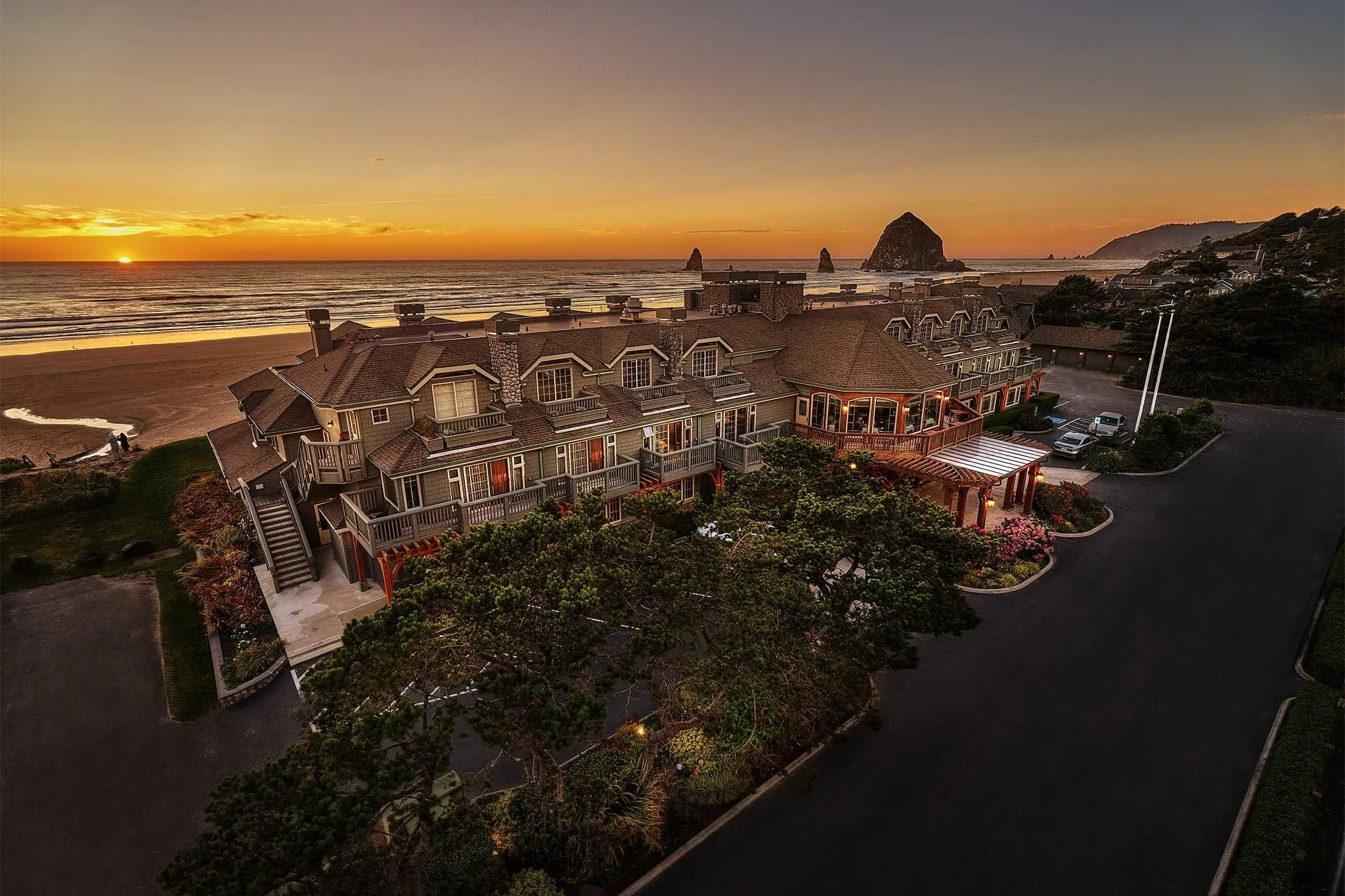 Stephanie Inn Cannon Beach aerial view at sunset with beach and Haystack Rock