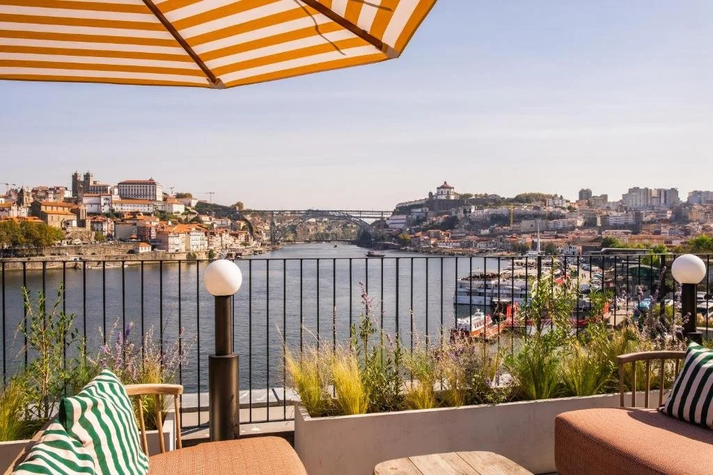 The Rebello Hotel Spa Vila Nova de Gaia terrace view of the Douro River with Porto Ribeira Cathedral and Dom Luís I Bridge