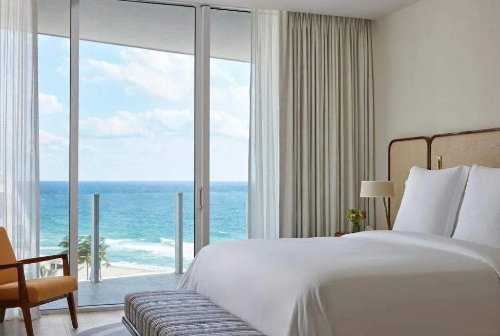 Four Seasons Fort Lauderdale hotel room with direct Atlantic Ocean view through floor-to-ceiling sliding glass door