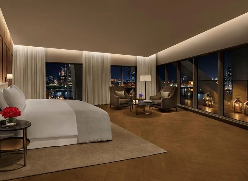 The Abu Dhabi EDITION balcony room overlooking Al Bateen marina at night