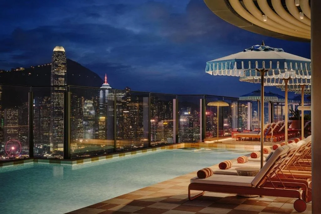 Kimpton Tsim Sha Tsui Hong Kong rooftop pool with panoramic night skyline view