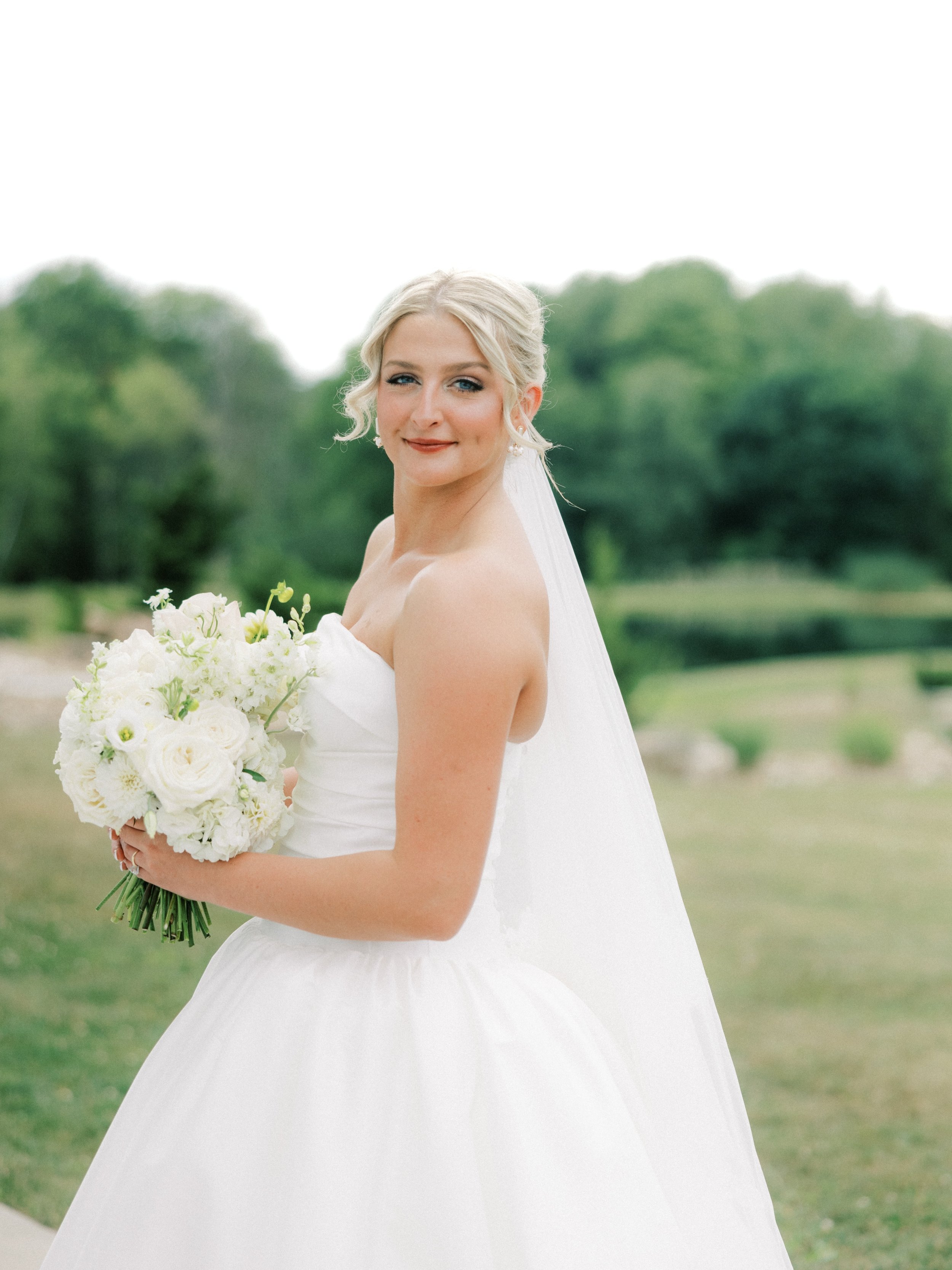 Still dreaming about Haeley &amp; Nick&rsquo;s wedding day. 🤍 ✨ From the classic white bouquet to the ceremony urns, cake flowers, dance floor florals, and the floral table lamps, every detail came together beautifully! We loved bringing these uniqu