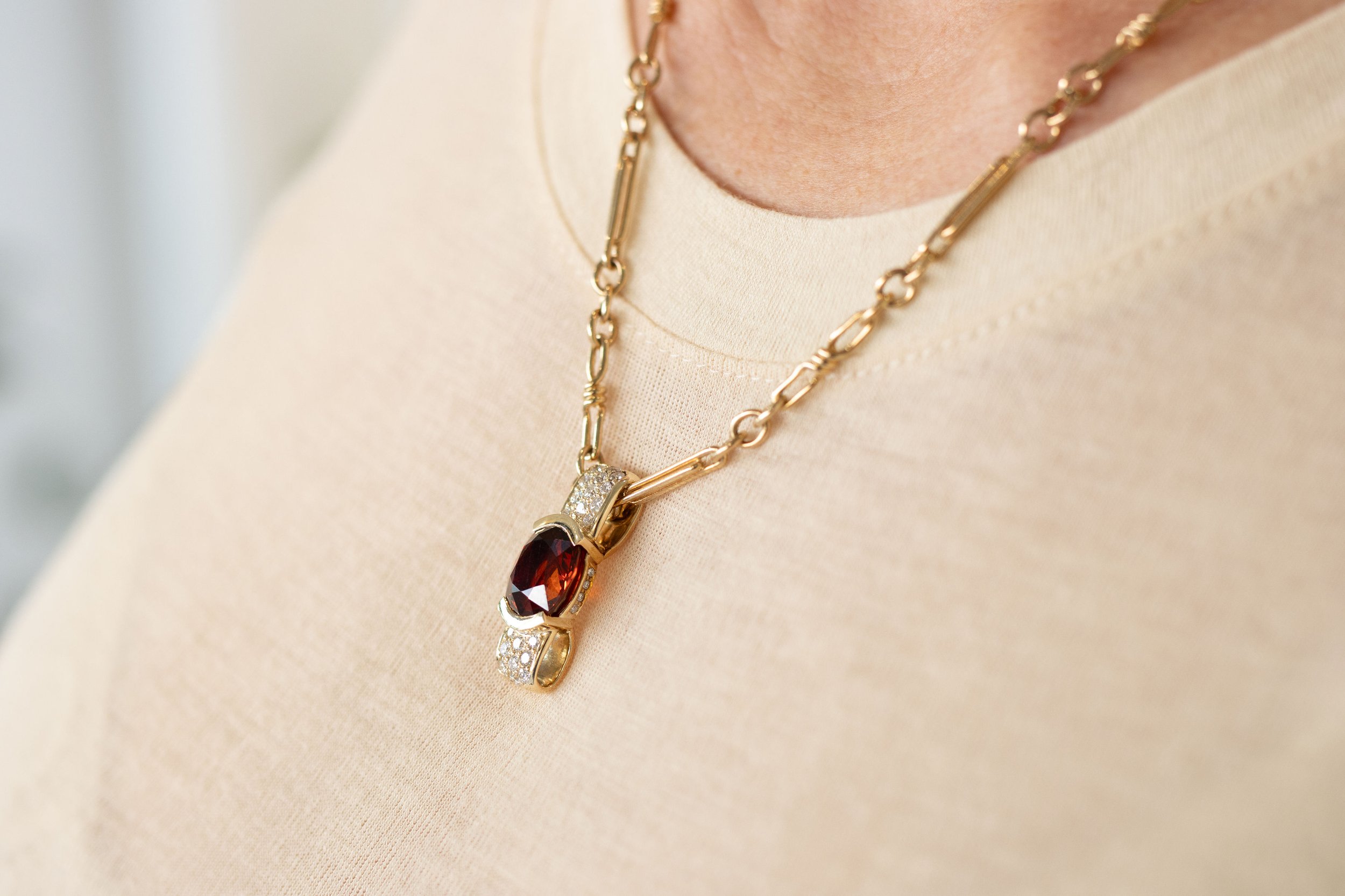 Spesserite Garnet and diamondd pendant on .jpg