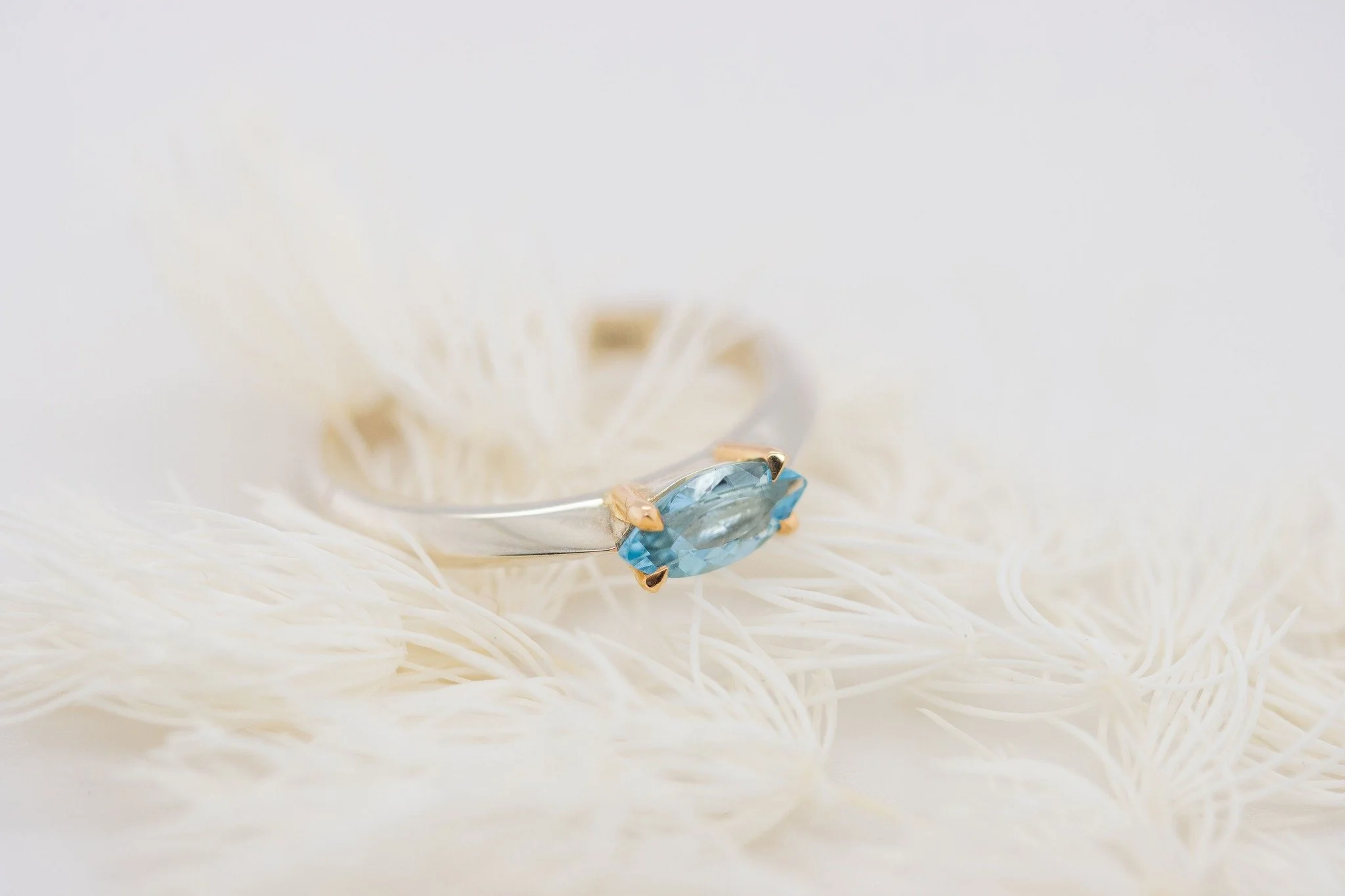 March birthstone, aquamarine, symbolises the calm and cleansing energy of the ocean. 
This marquis shape aqua and white gold ring set with golden claws might be the ocean energy you need! 

#aquamarinering #marquisring #whitegoldring #madeinnewzealan