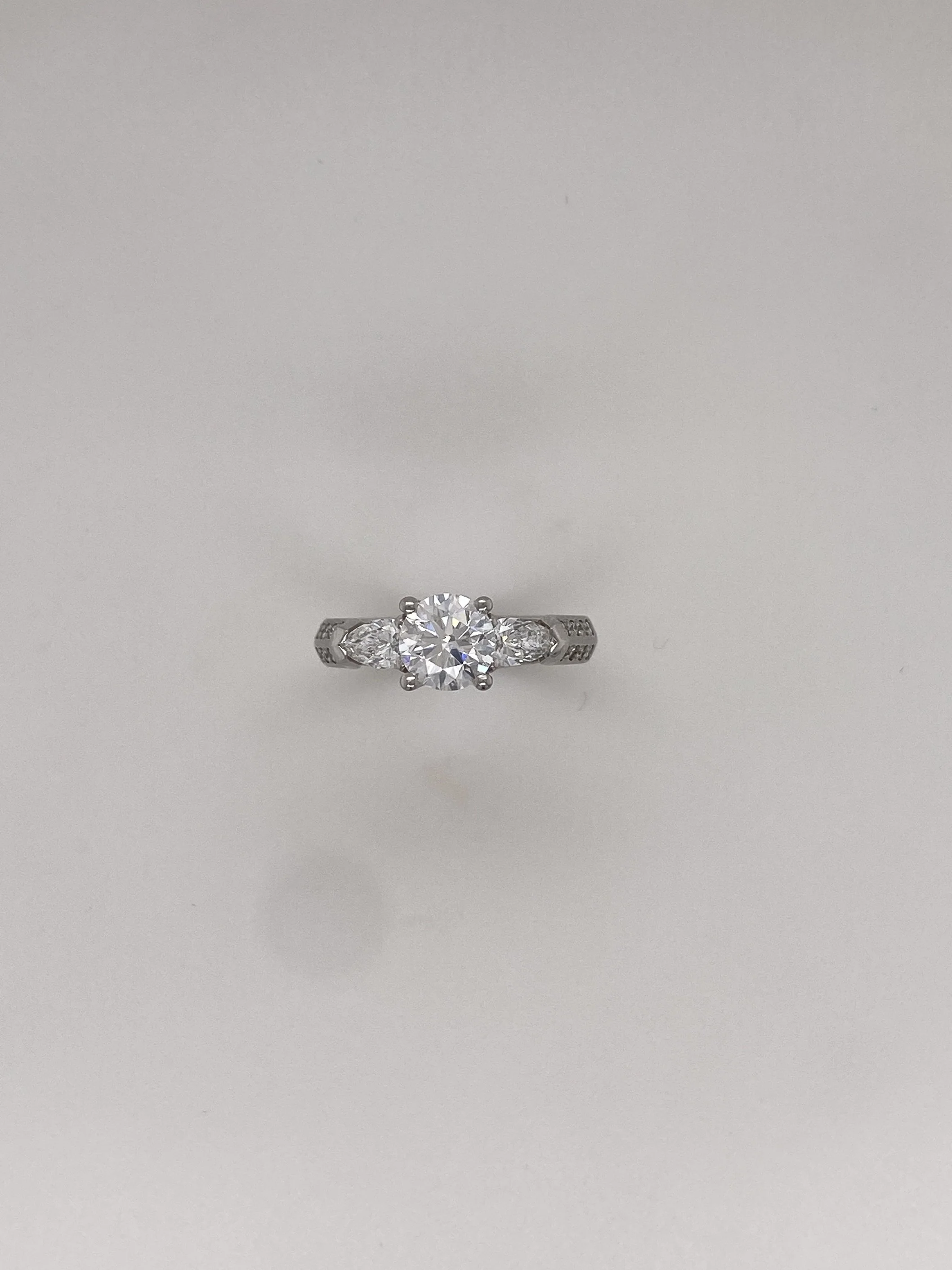 3 Stone Pear and Round Diamond Platinum Ring