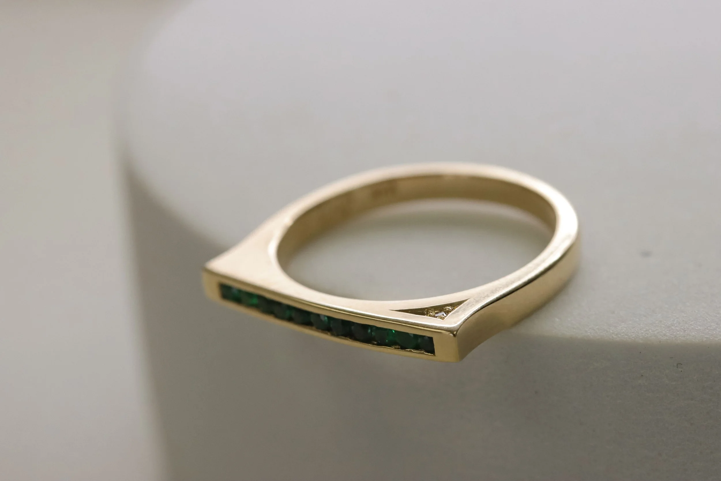 Emerald channel set stacker ring.jpg