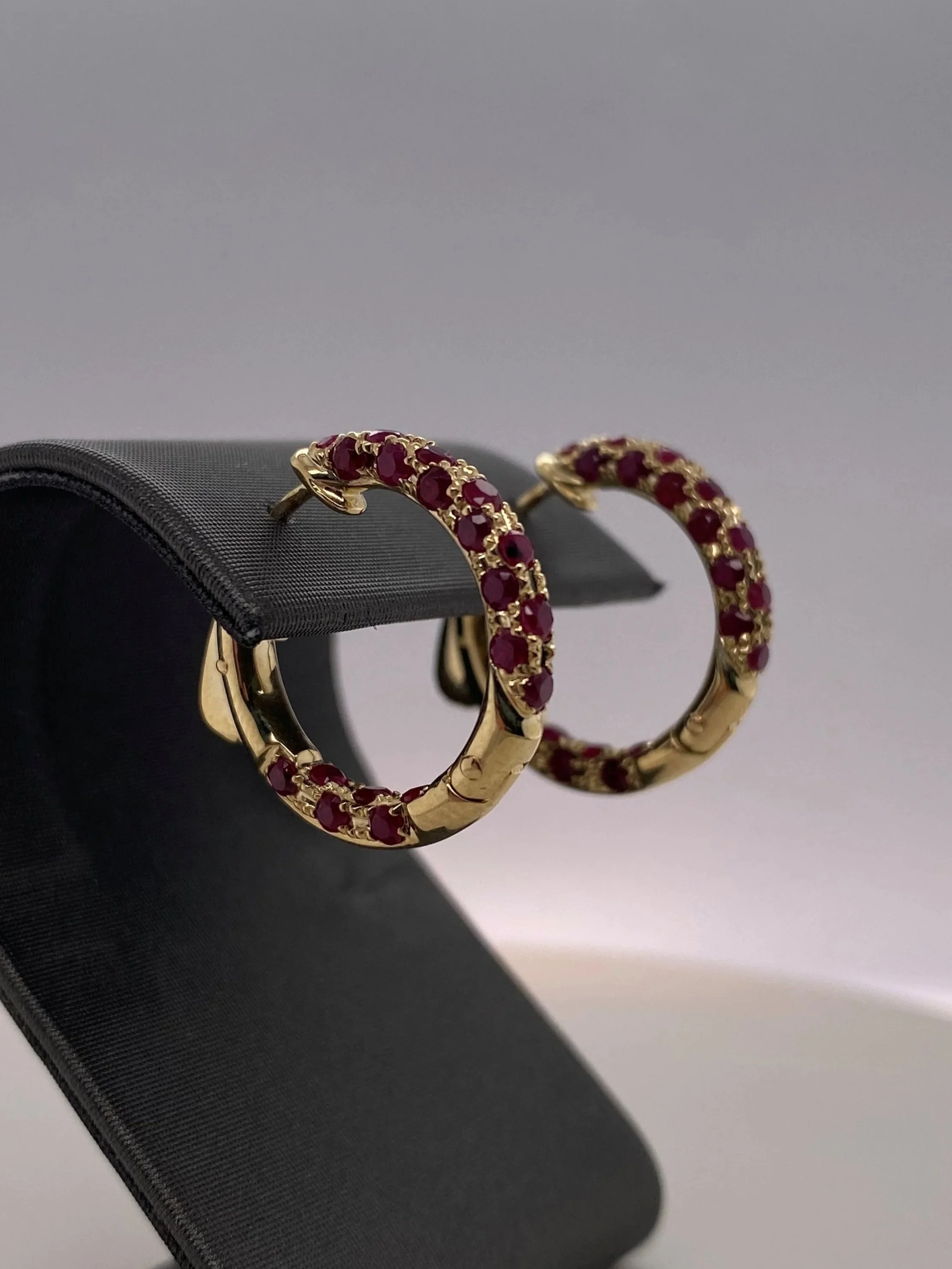 9ct+yellow+gold+ruby+hoop+earrings+on+stand.jpg