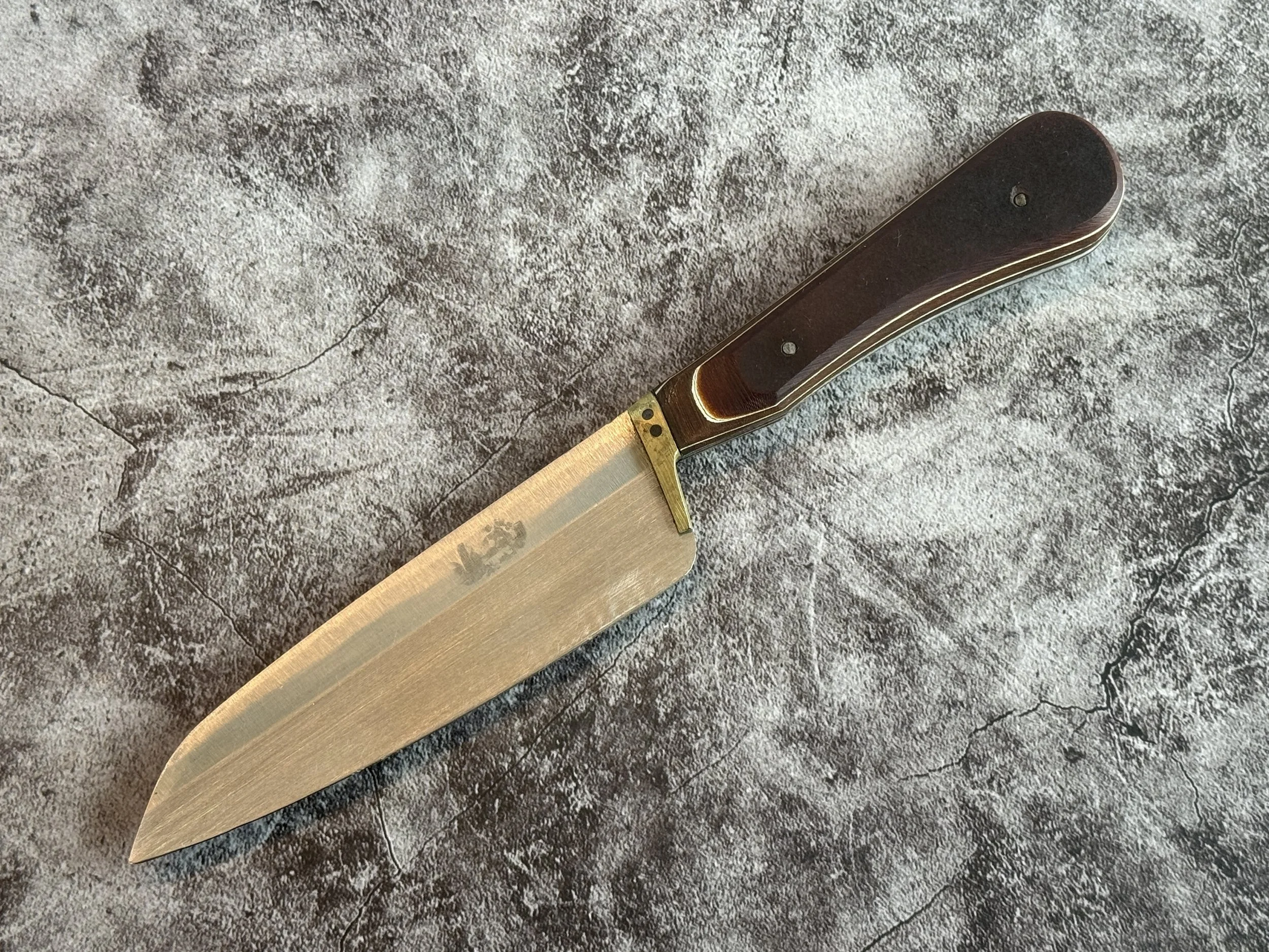 Traditional Iranian kitchen utility knife with timber handle and brass bolster.
