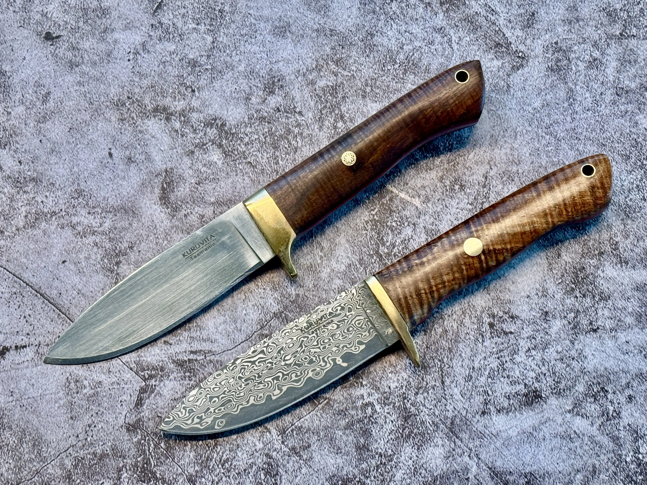 Two handmade drop point hunting knives with figured timber handles, made by Tasmanian knife maker Philip Kuruvita.