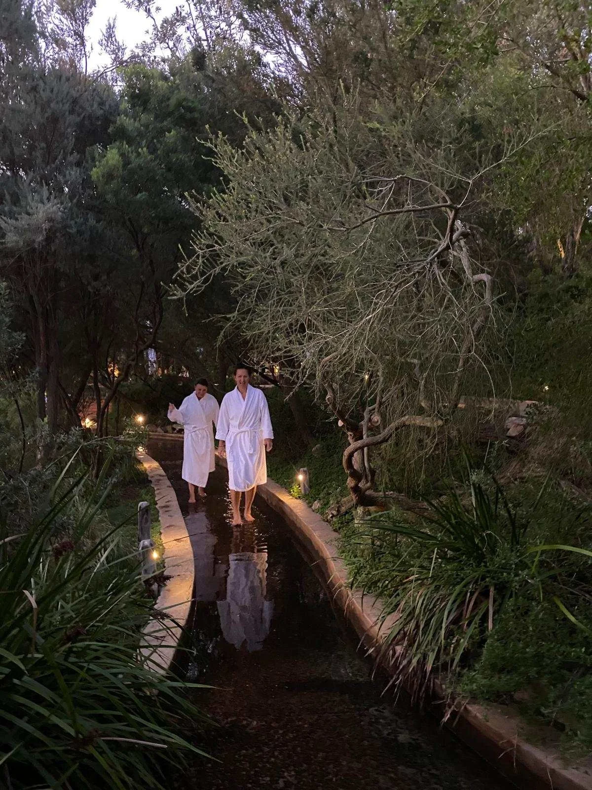 Women enjoying Peninsula Hot Springs thermal foot pool
