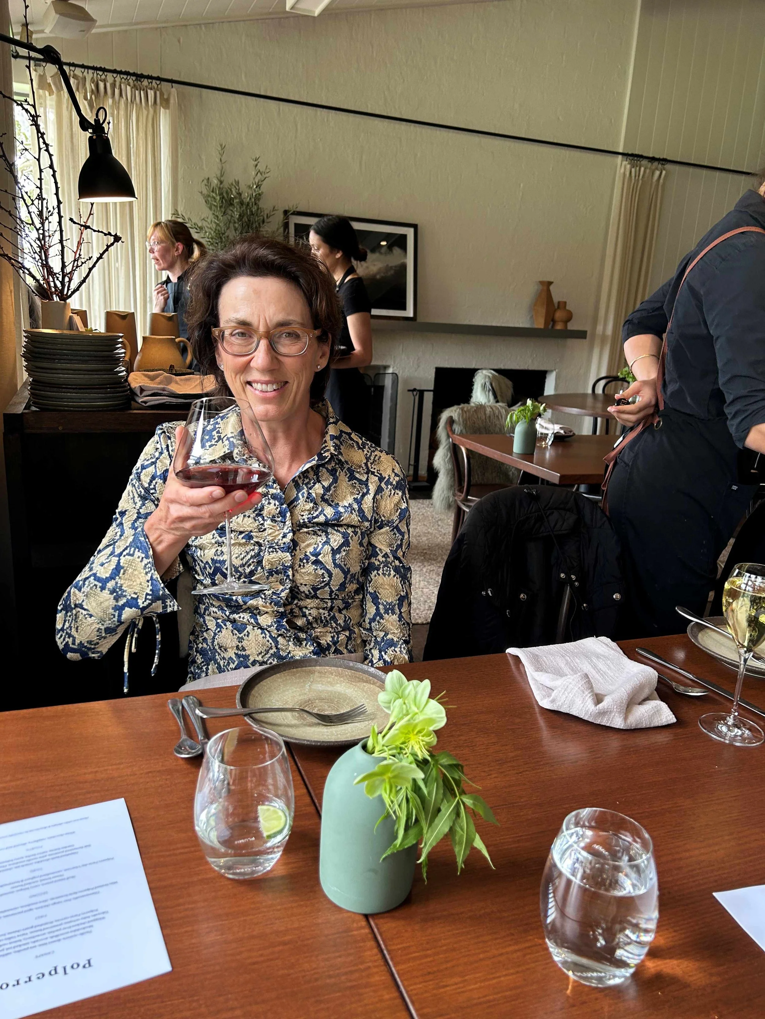 Woman with glass of Pinot Noir from Polperro Wines