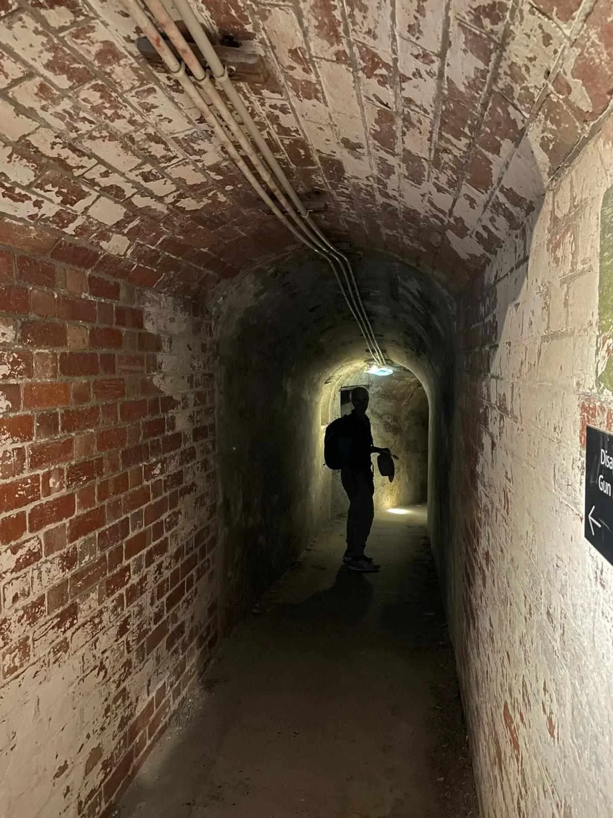 Woman exploring Port Nepean war tunnels