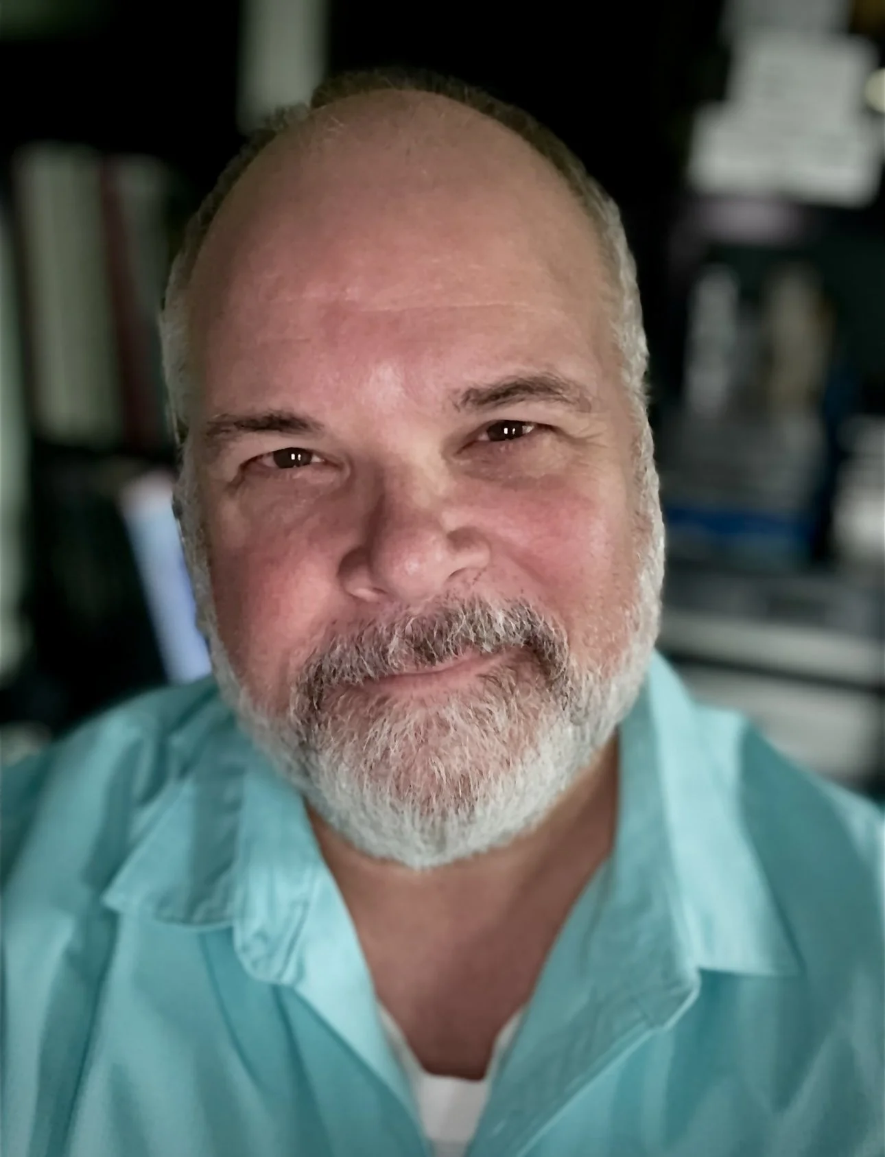 Guy Dye looking semi-professional in a teal shirt.