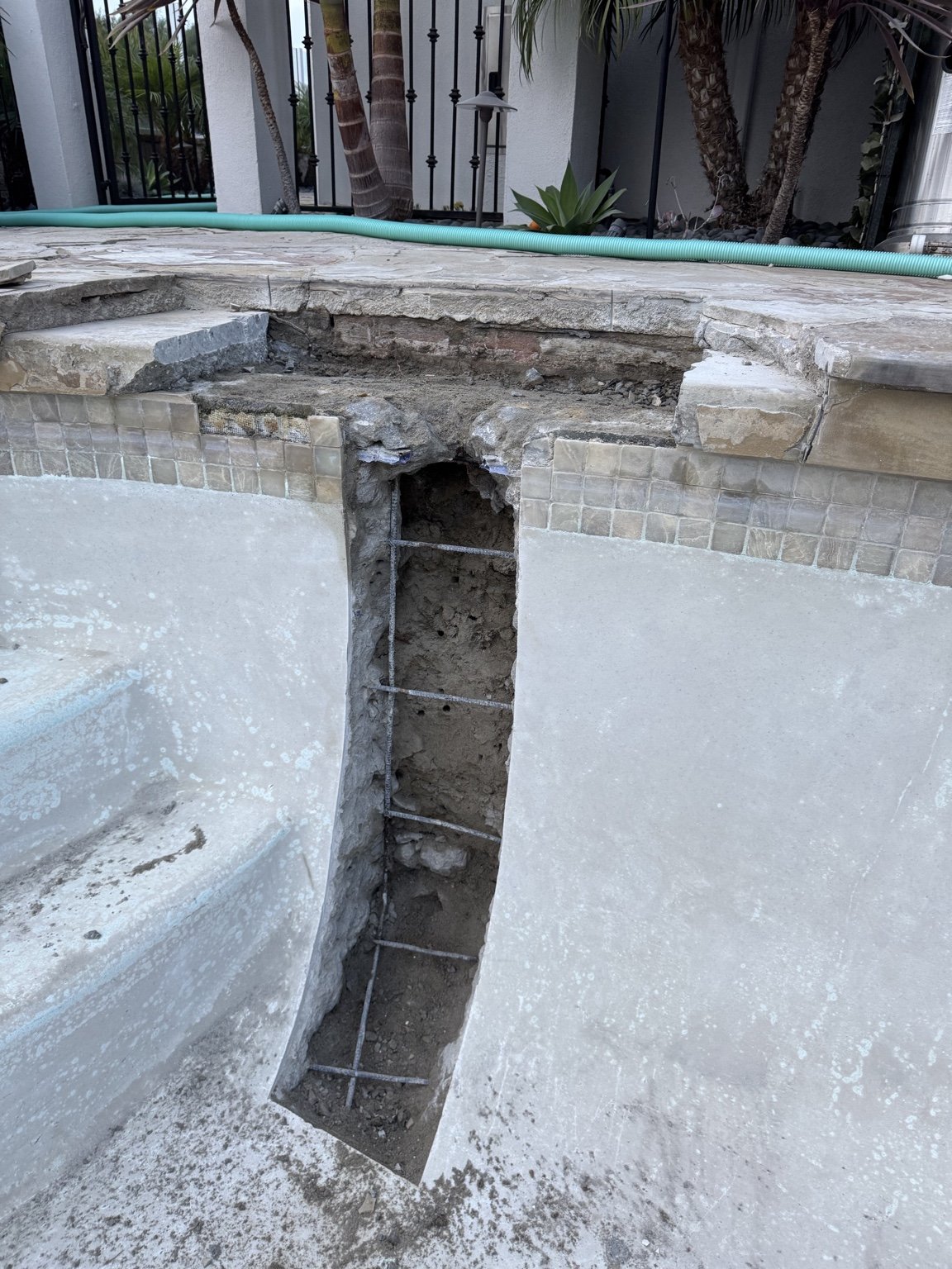 Structural swimming pool crack opened and reinforced with steel before reconstruction