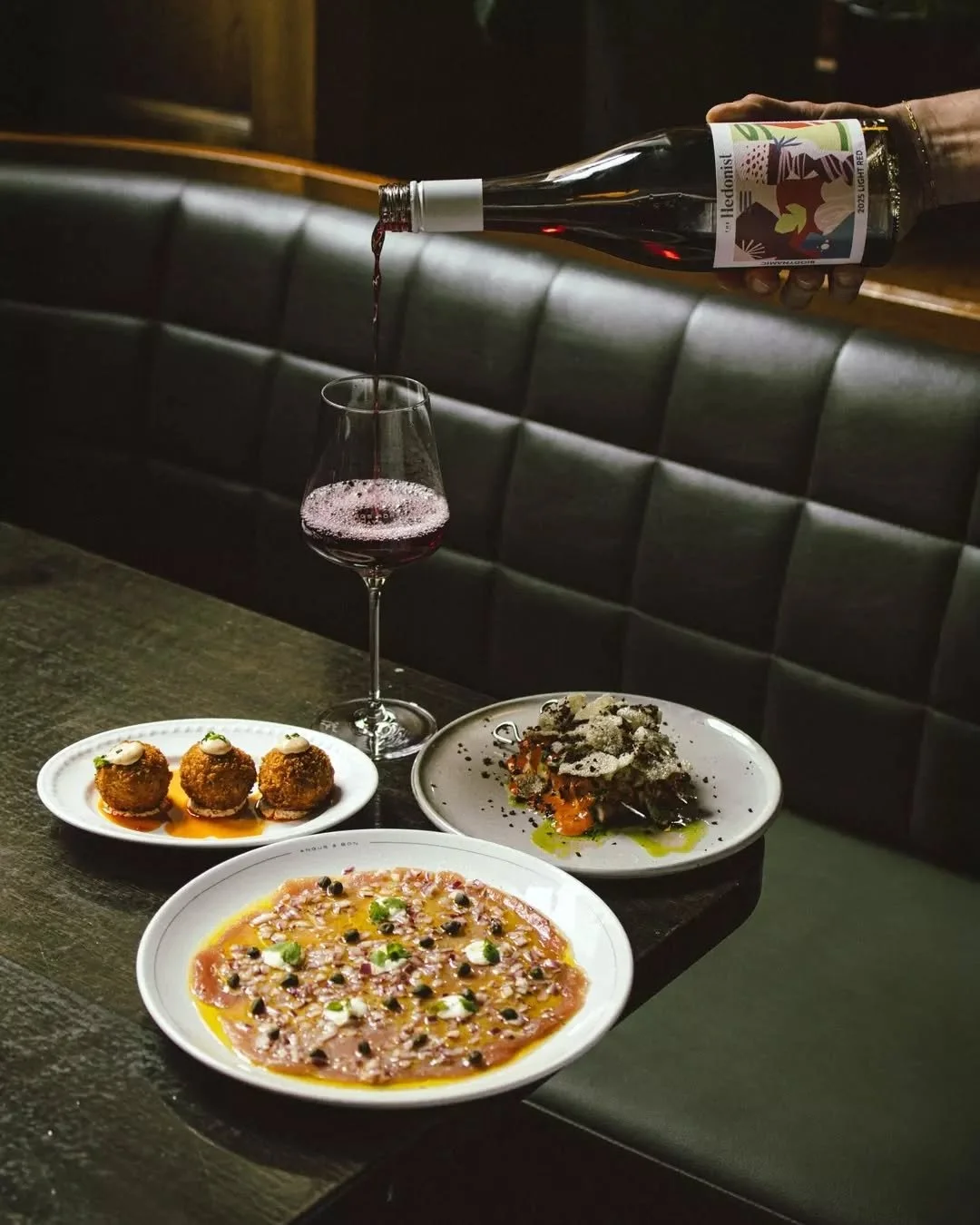 A few plates to pass around while you figure out the rest. Brisket and corn croquettes, yellowfin sliced thin with capers and horseradish, octopus charred over the hibachi.