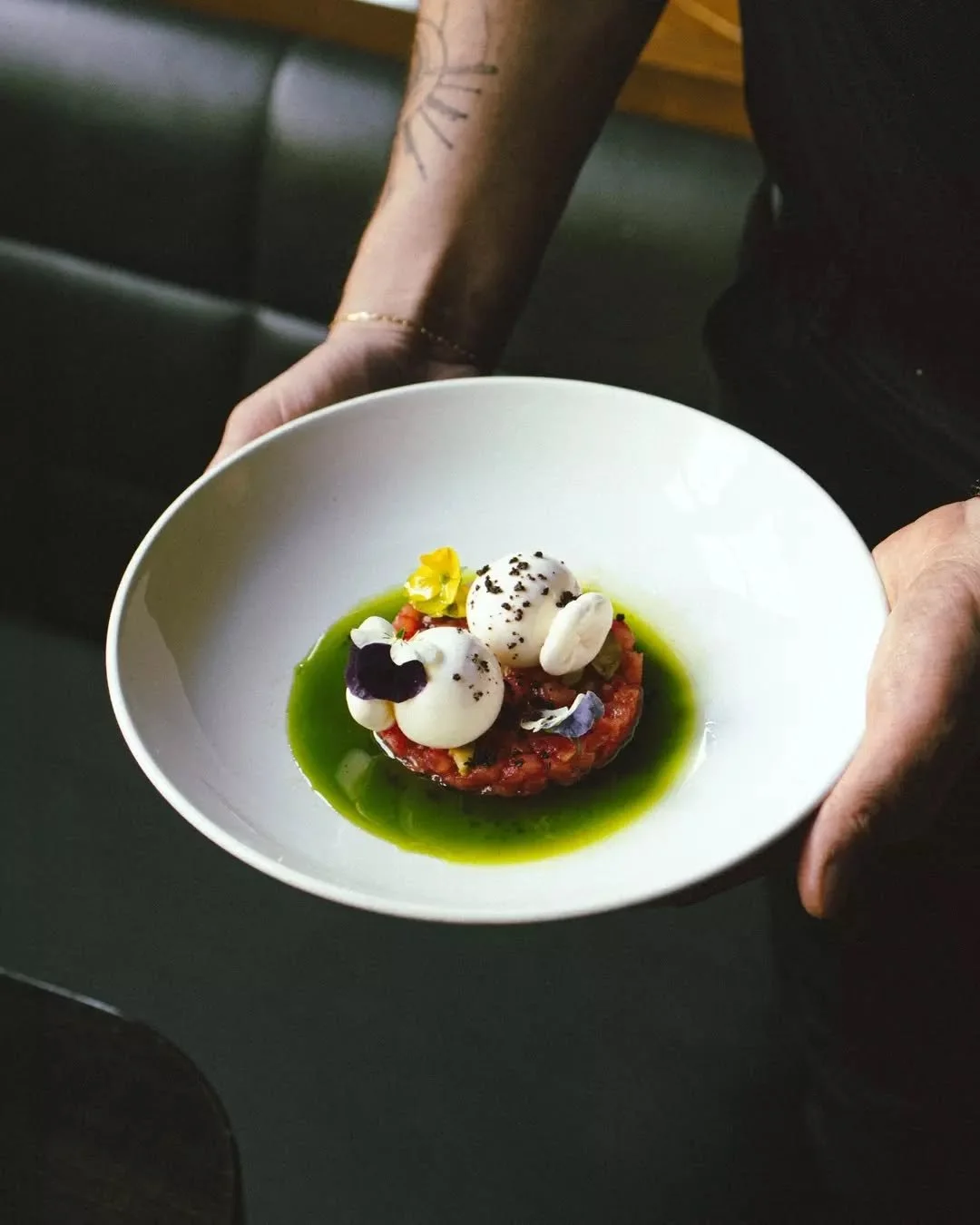 HAND STRETCHED BURRATA
A celebration of the season. 
Tomato tartare, green olive, basil oil, sourdough.