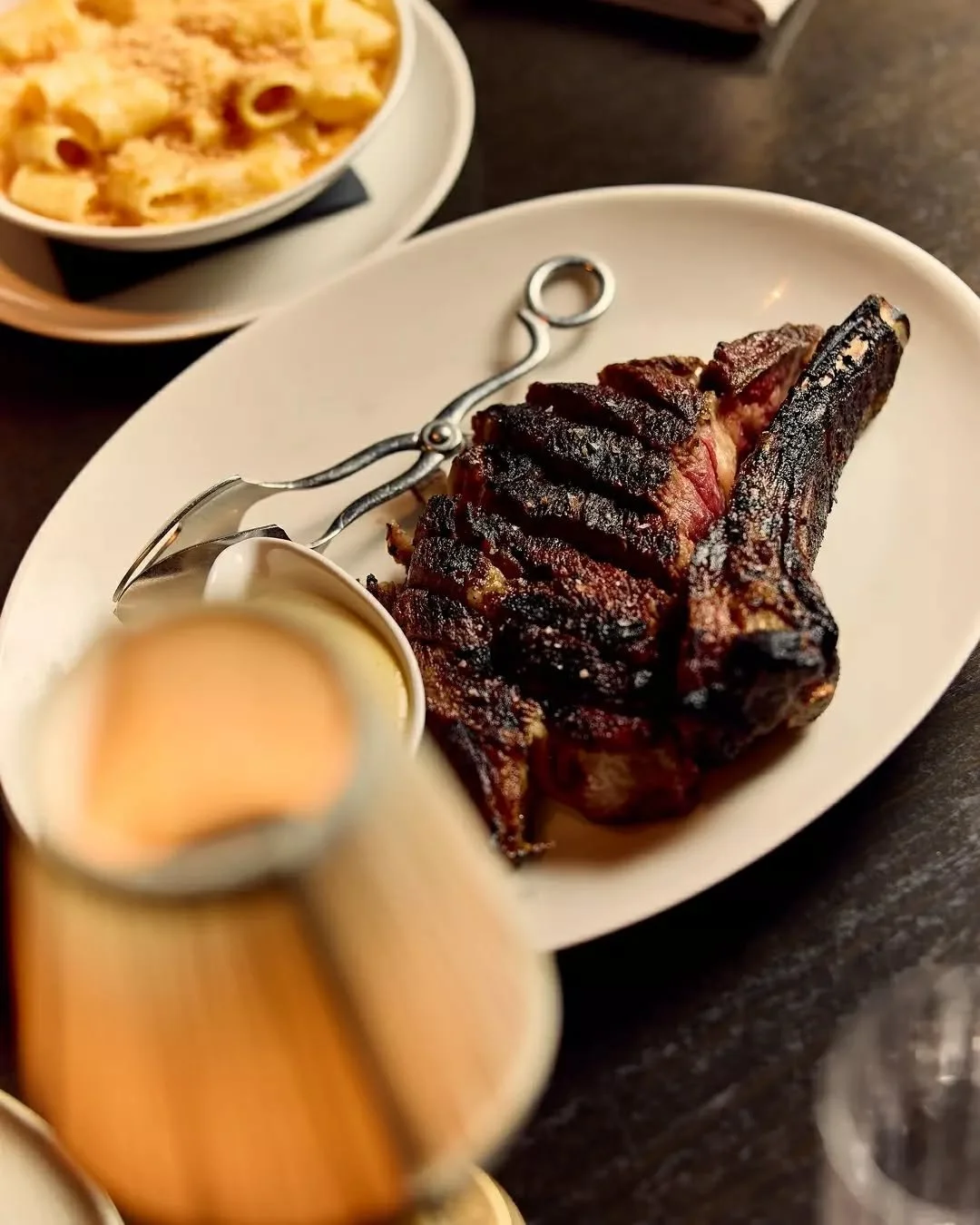 800g dry-aged O'Connor's ribeye grilled over open flames until perfectly charred. Served alongside lobster mash, mac &amp; cheese made with aged Irish cheddar, and shoestring fries. Tonight from 5pm. Walk-ins welcome.