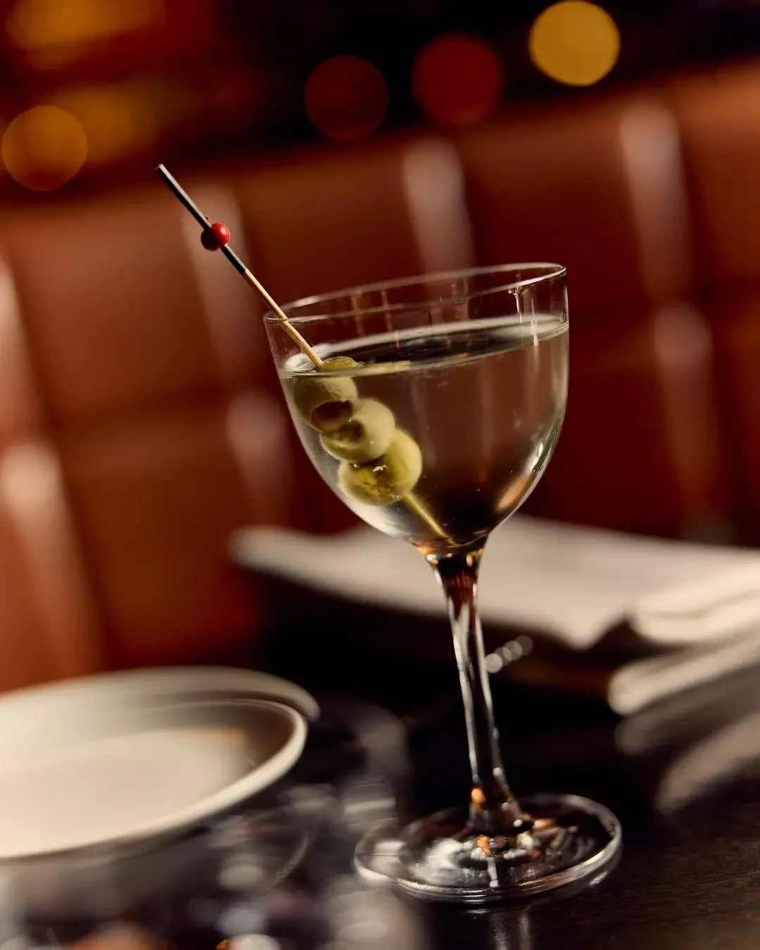 Angus &amp; Bon's signature Mini Martini.

Bombay Sapphire Gin. House blend vermouth. 

Three olives, because you're still deciding on the menu.

It's not a choice, it's an obligation.