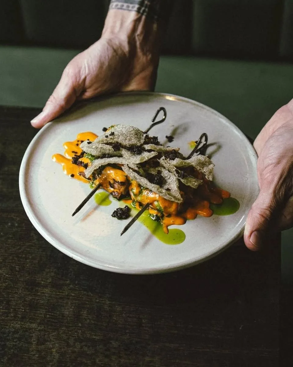 Charcoal-grilled octopus skewers.

Parsley sauce, chilli aioli.

A small plate with plenty to say.

Bon App&eacute;tit.