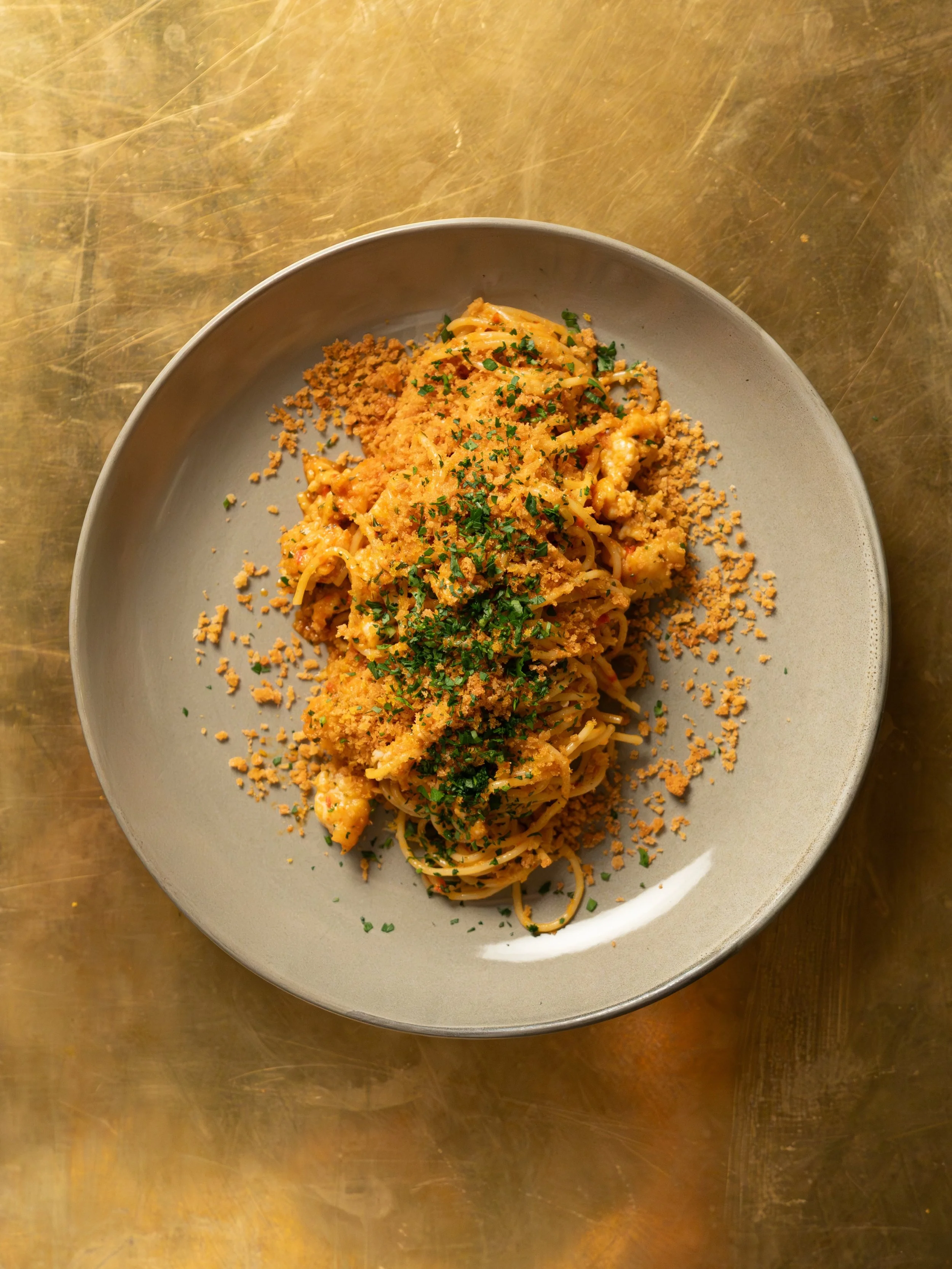 Delicate and refined.

Our Blue Swimmer Crab Spaghettini has been on the menu long enough it&rsquo;s like an old friend.

Chilli sofrito gives the dish its depth and kick, white wine and bottarga its minerality and elegance.

Explore our winter menu 